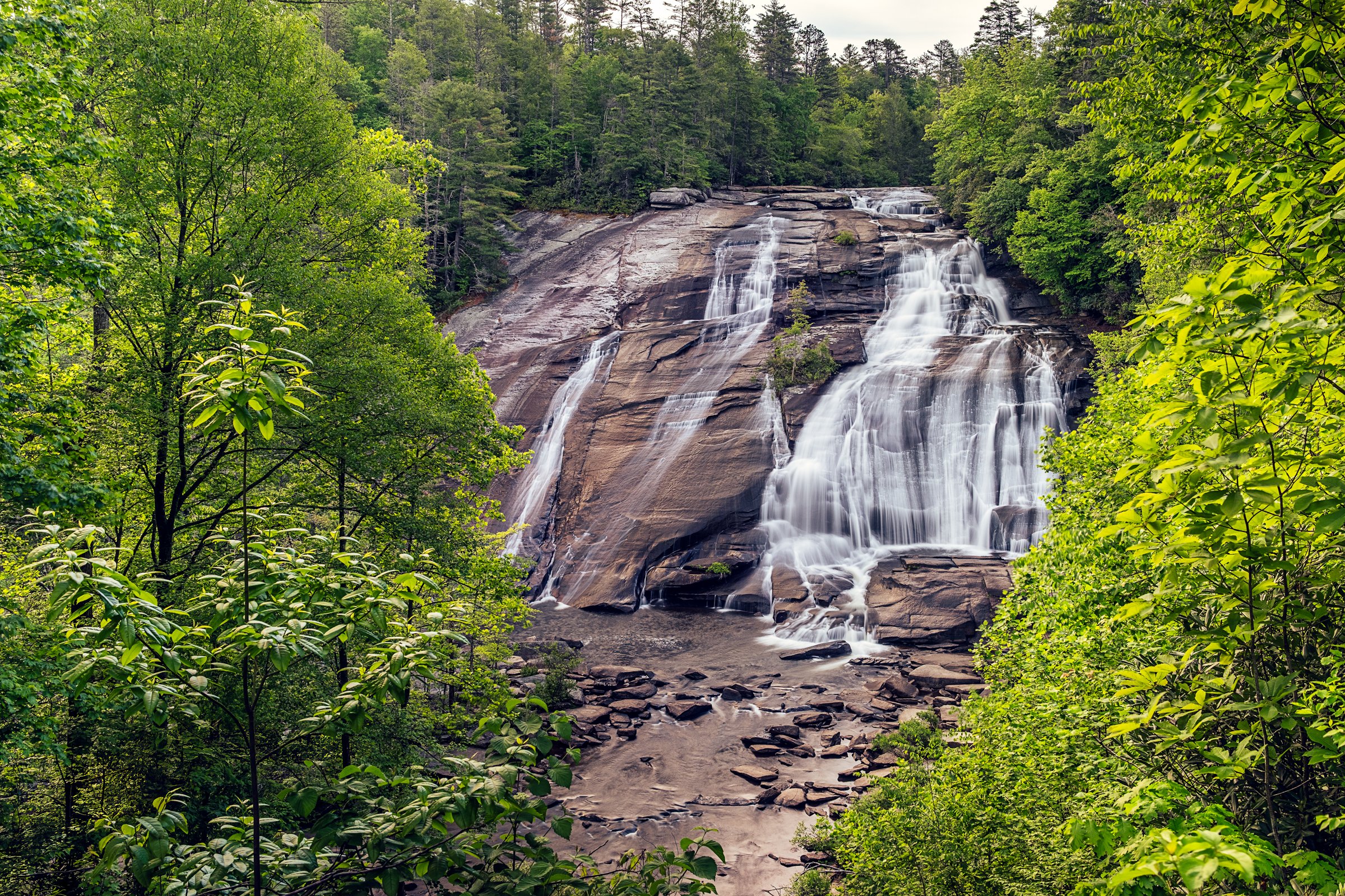 Hooker Falls and High Falls, two waterfalls in DuPont State Forest near Asheville, North Carolina. Photographed by Lange Photo Studio. 