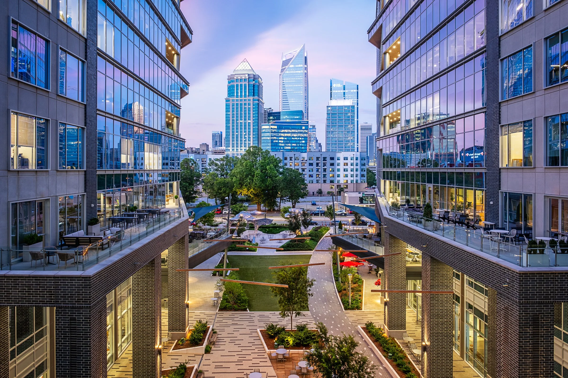 Vantage South End Charlotte, nightime, beautiful colors, Charlotte Skyline, designed by LandDesign, photo graphed by Lange Photo Studio. 