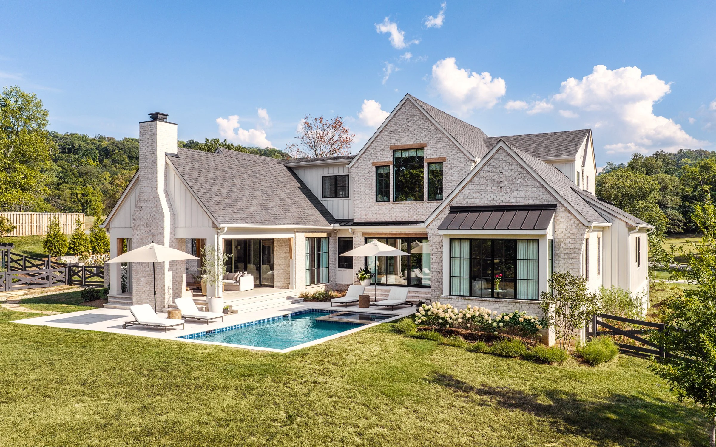Architectural and interior photography of a custom home in Nashville, Tennessee, designed by Origin Architecture and photographed by Paul Lange of Lange Photo Studio. Warm light from the home’s fixtures highlights thoughtful architectural details and