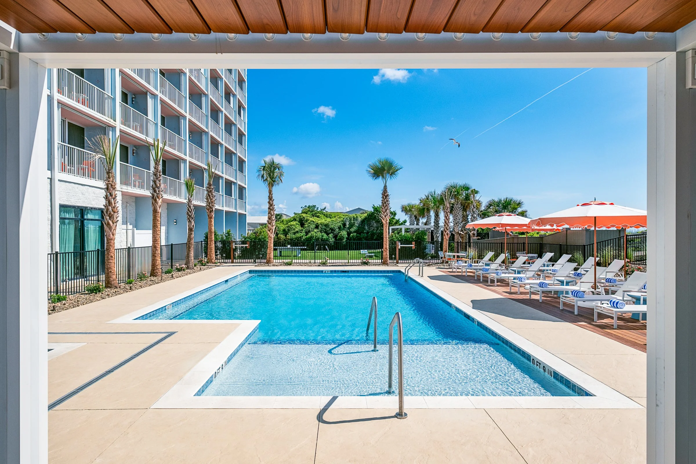 New Pool area photography at Golden Sands Hotel, showing thoughtful composition, branded consistency, fun, and uncluttered guest environment. Photographed by Lange Photo Studio. 