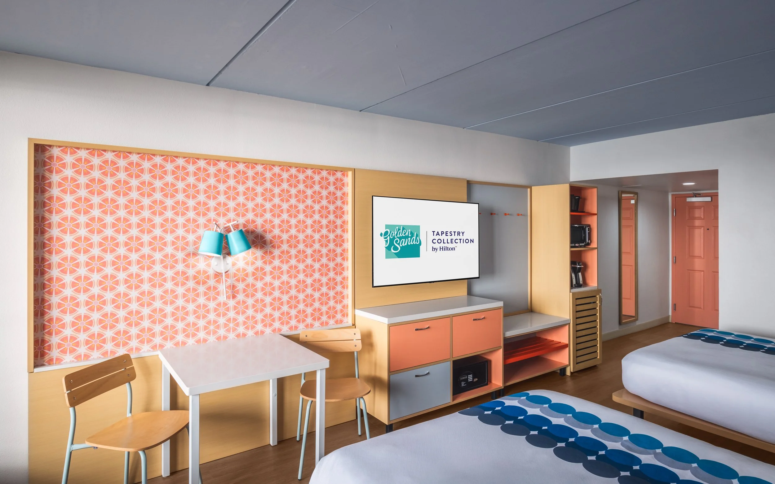 Photograph of guest room at Golden Sands Hotel, featuring crisp lighting, minimalist setup, and adherence to Hilton guest-ready standards.