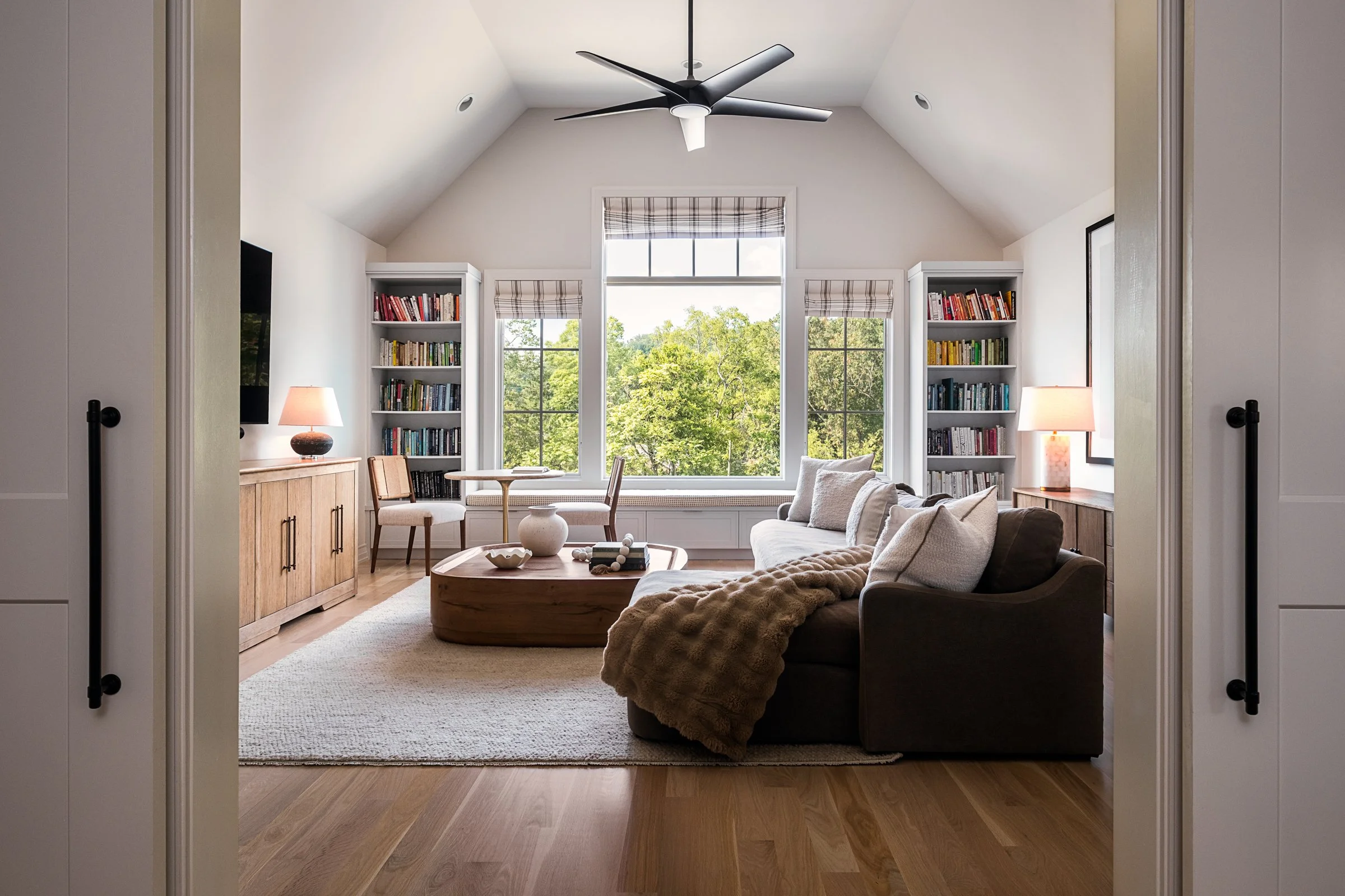 Architectural and interior photography of a custom home in Nashville, Tennessee, designed by Origin Architecture and photographed by Paul Lange of Lange Photo Studio. Warm light from the home’s fixtures highlights thoughtful architectural details and