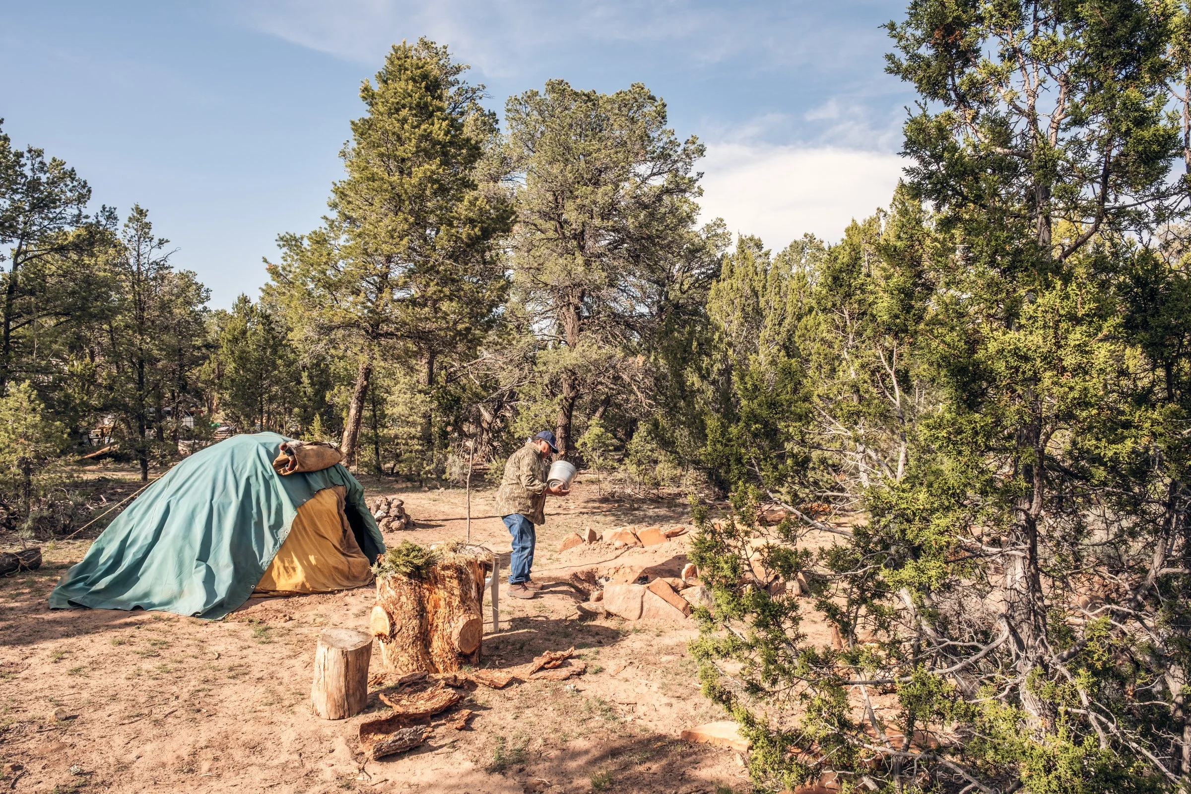 Hauling Life | Navajo Nation — Unified Metadata Paragraphs

Wayne Wilson and Joann Whiting collect water in Gallup, New Mexico at a community water source. The containers are filled, prepared, and loaded into their vehicle for transport across the Na