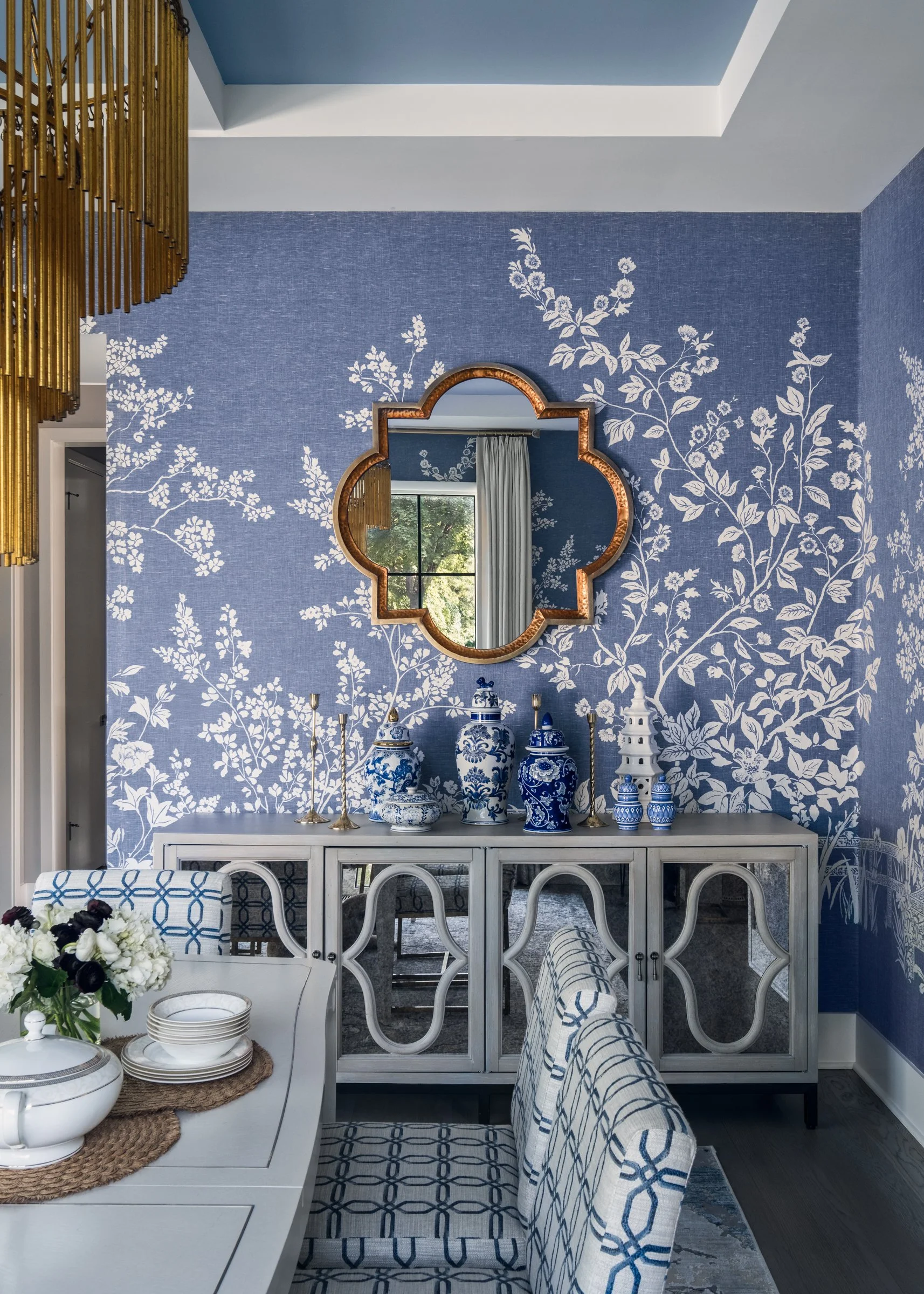 Architectural photography of TK Design Group dining room, showcasing interior design, wall paper, and unique decor. 