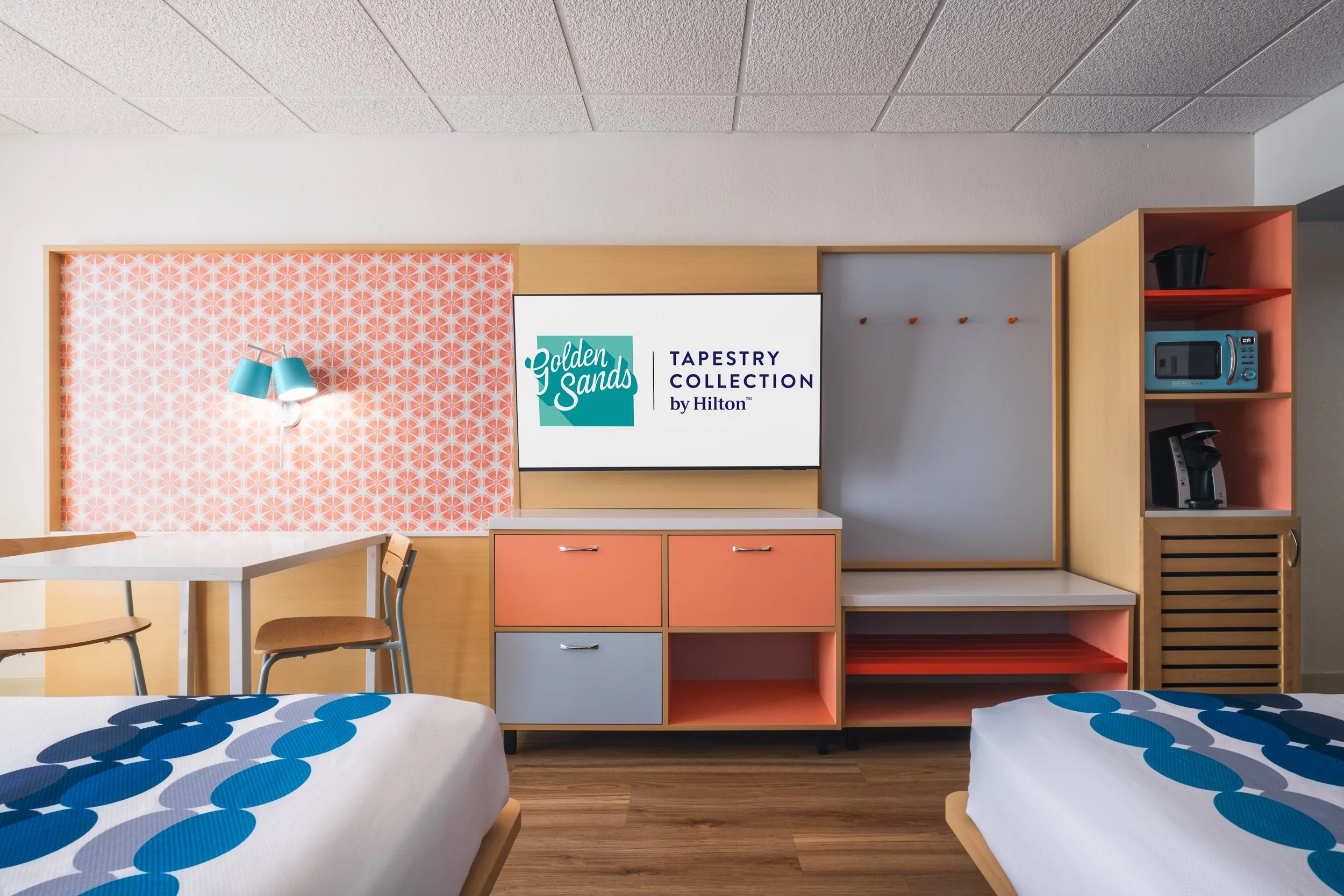 Photograph of guest room at Golden Sands Hotel, featuring crisp lighting, minimalist setup, and adherence to Hilton guest-ready standards.