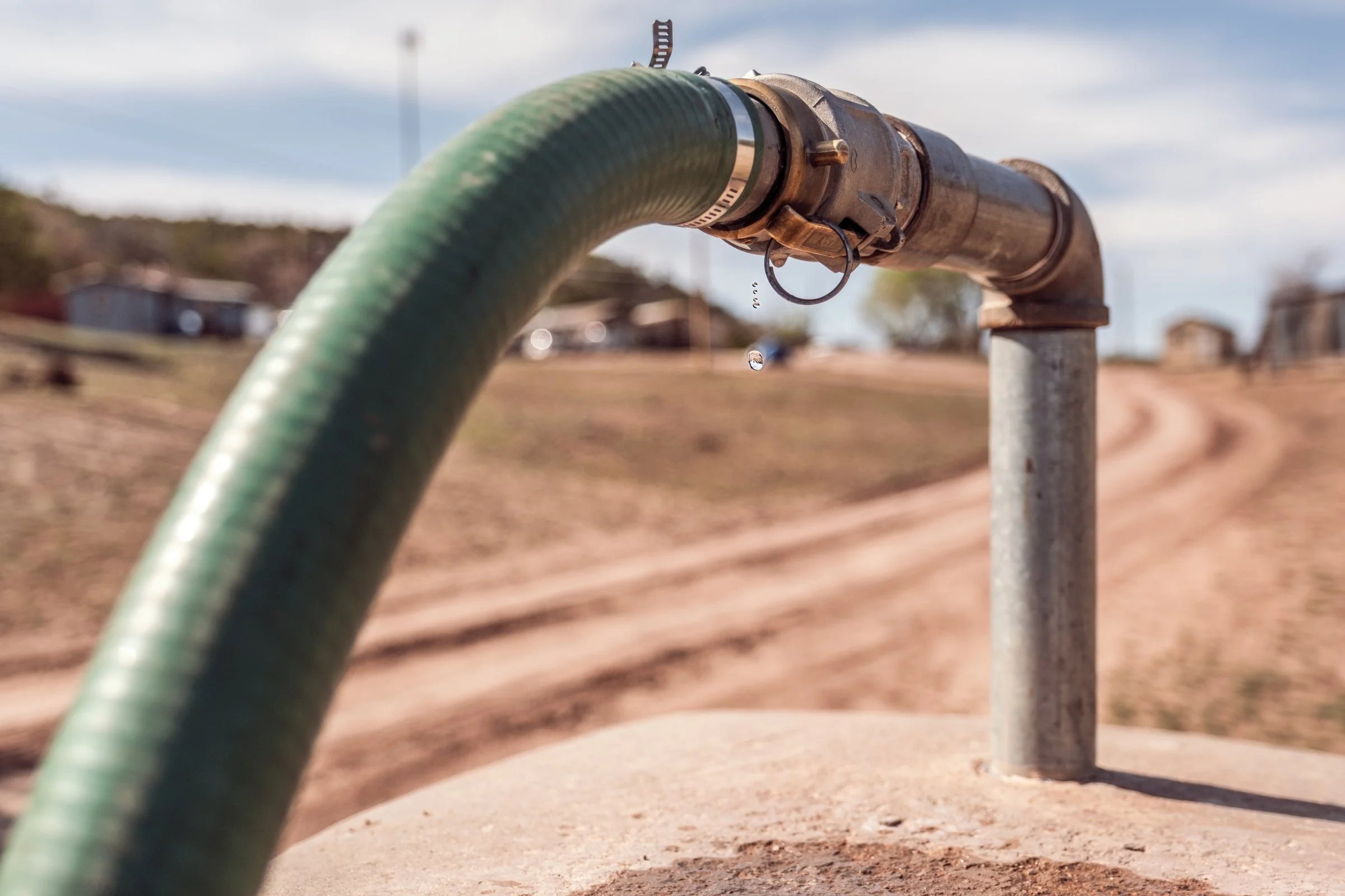 Hauling Life | Navajo Nation — Unified Metadata Paragraphs

Wayne Wilson and Joann Whiting collect water in Gallup, New Mexico at a community water source. The containers are filled, prepared, and loaded into their vehicle for transport across the Na