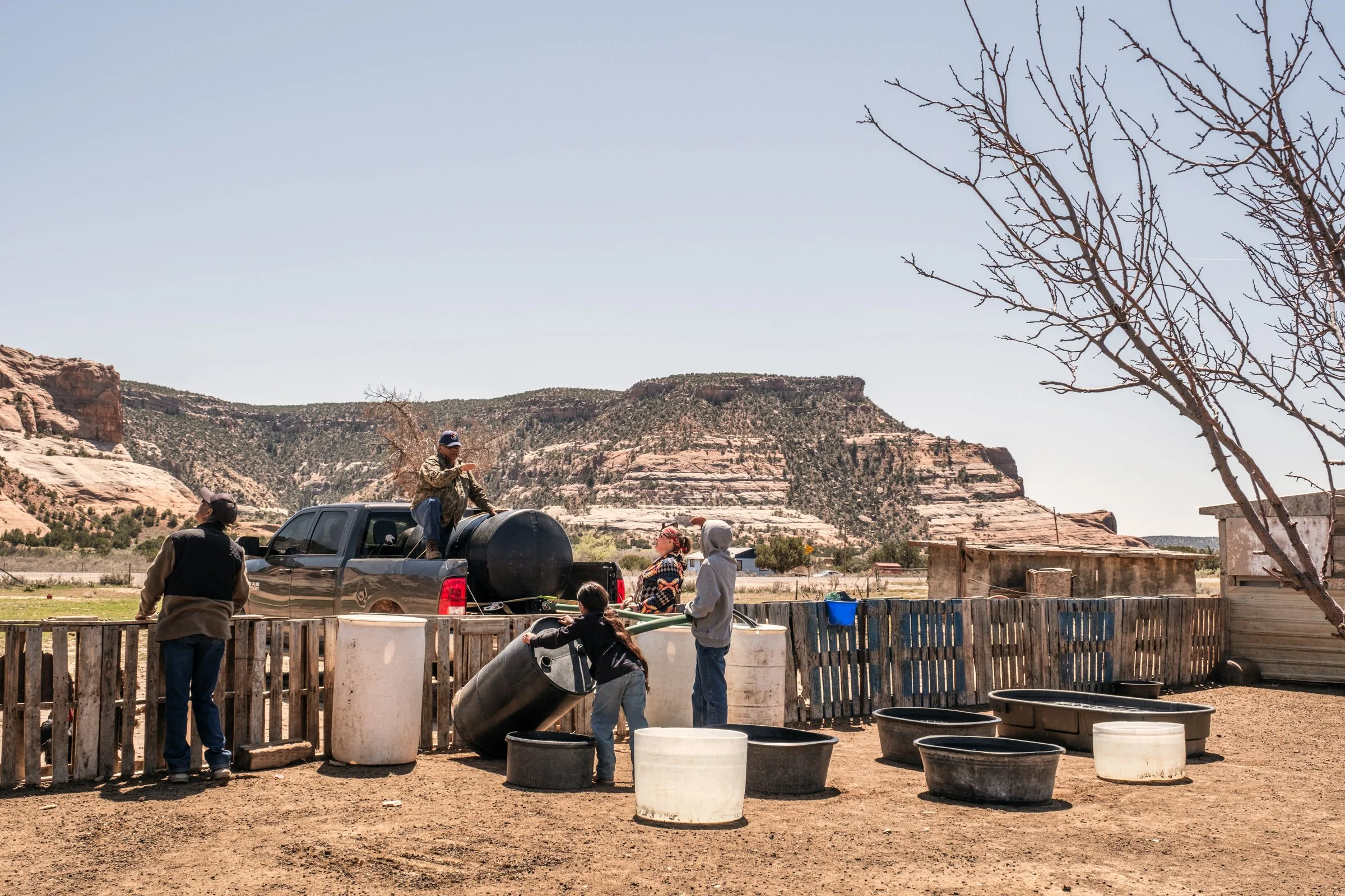 Hauling Life | Navajo Nation — Unified Metadata Paragraphs

Wayne Wilson and Joann Whiting collect water in Gallup, New Mexico at a community water source. The containers are filled, prepared, and loaded into their vehicle for transport across the Na