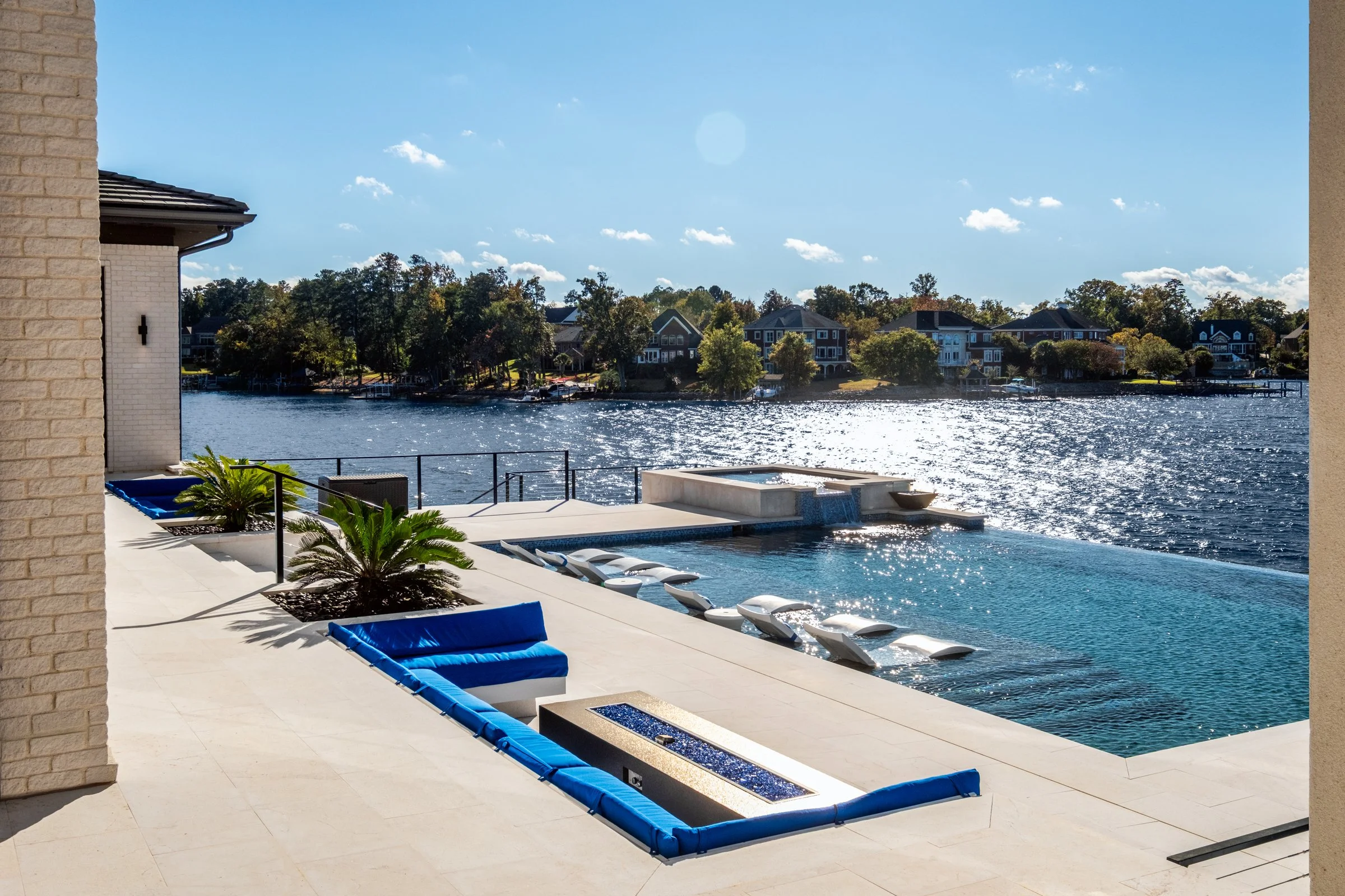 Architectural and interior photography of a customized lakefront home, highlighting design detail, atmosphere, infinity pool, and craftsmanship.