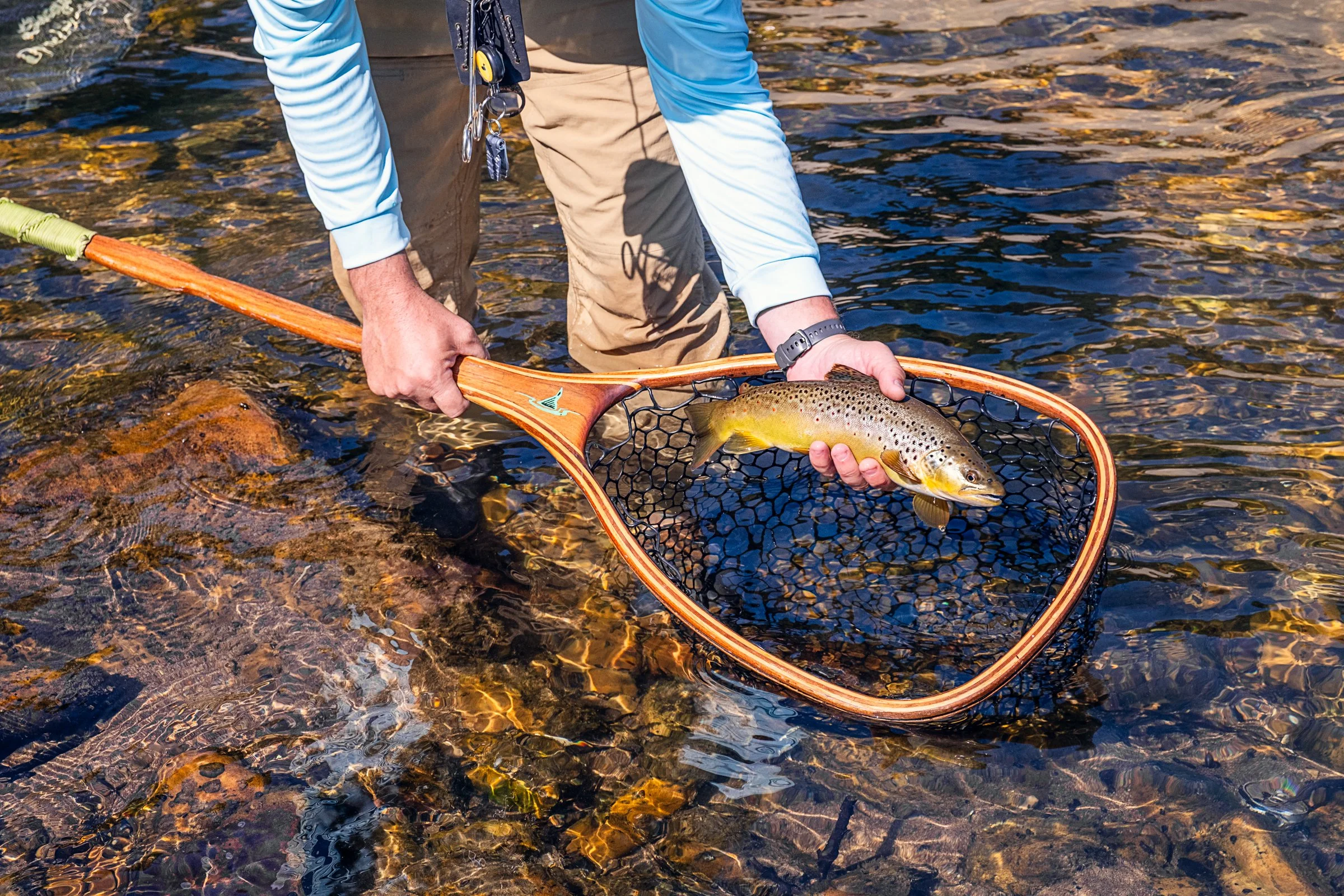 Guided fly fishing trip with Asheville Fly Fishing Company on a foggy river near Asheville, North Carolina. Photographed by Lange Photo Studio.