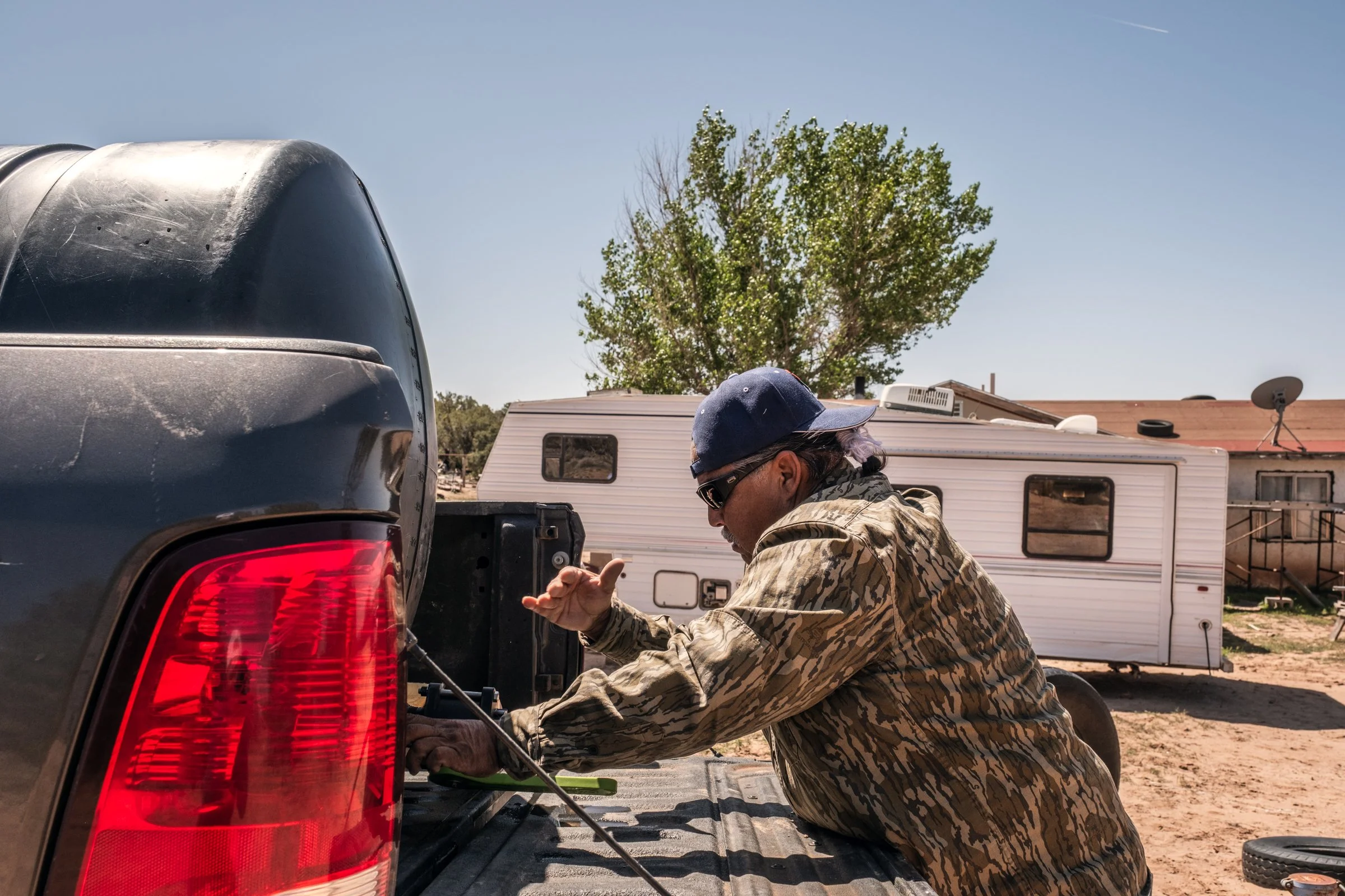 Hauling Life | Navajo Nation — Unified Metadata Paragraphs

Wayne Wilson and Joann Whiting collect water in Gallup, New Mexico at a community water source. The containers are filled, prepared, and loaded into their vehicle for transport across the Na