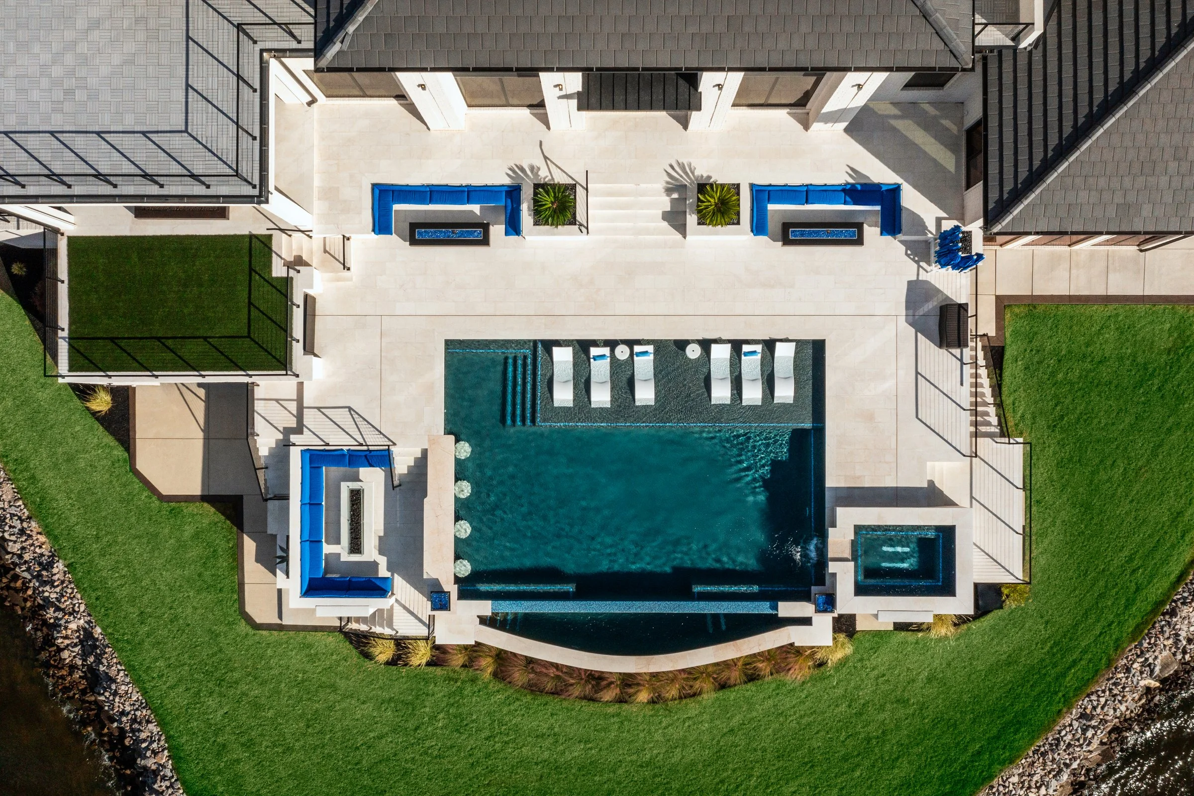 Architectural and interior photography of a customized lakefront home, highlighting design detail, atmosphere, infinity pool, and craftsmanship.