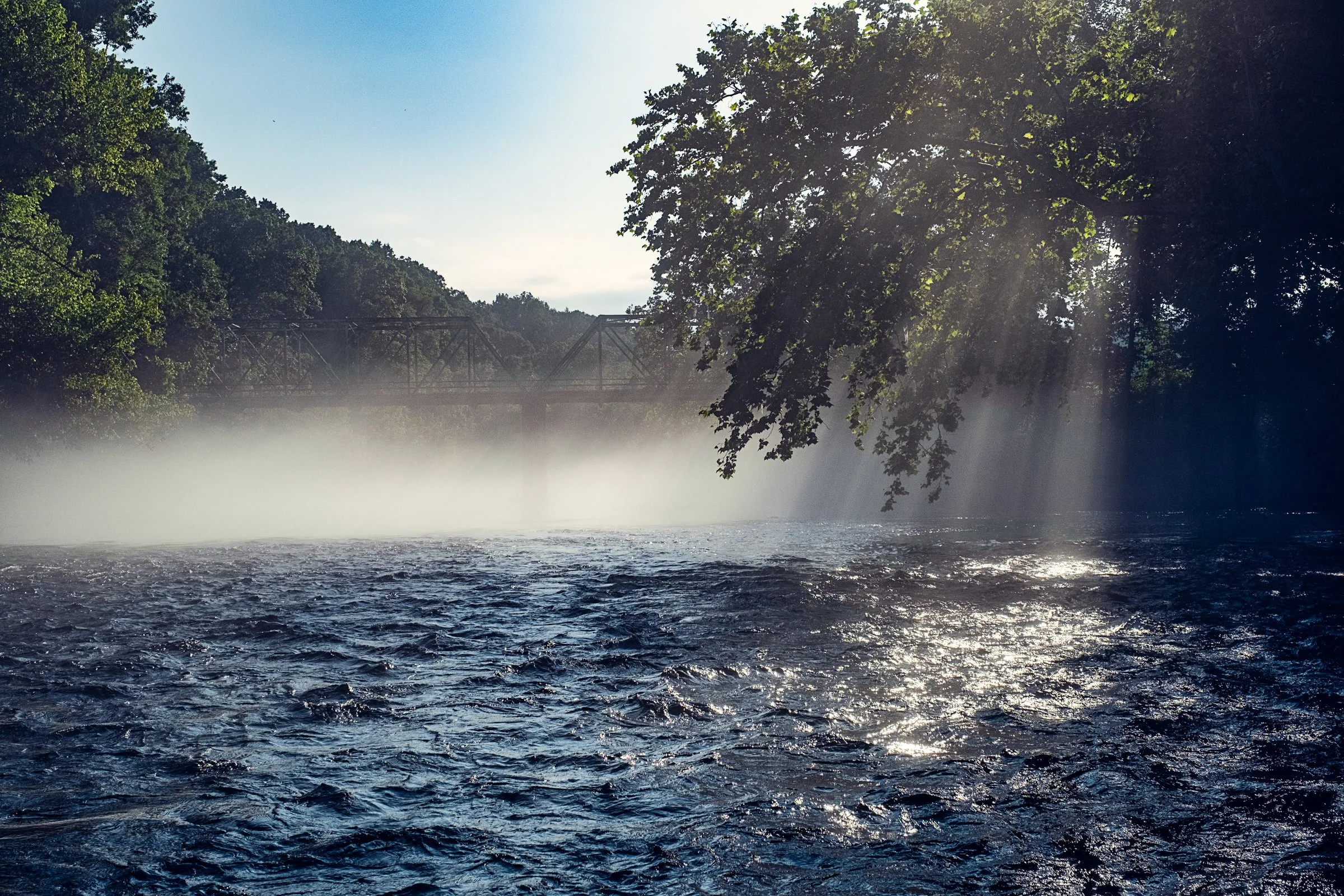 Guided fly fishing trip with Asheville Fly Fishing Company on a foggy river near Asheville, North Carolina. Photographed by Lange Photo Studio.