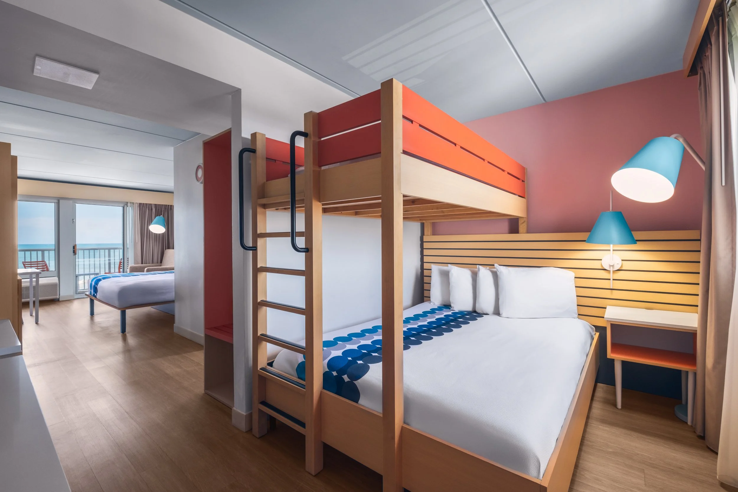 Photograph of guest room at Golden Sands Hotel, featuring crisp lighting, minimalist setup, and adherence to Hilton guest-ready standards.