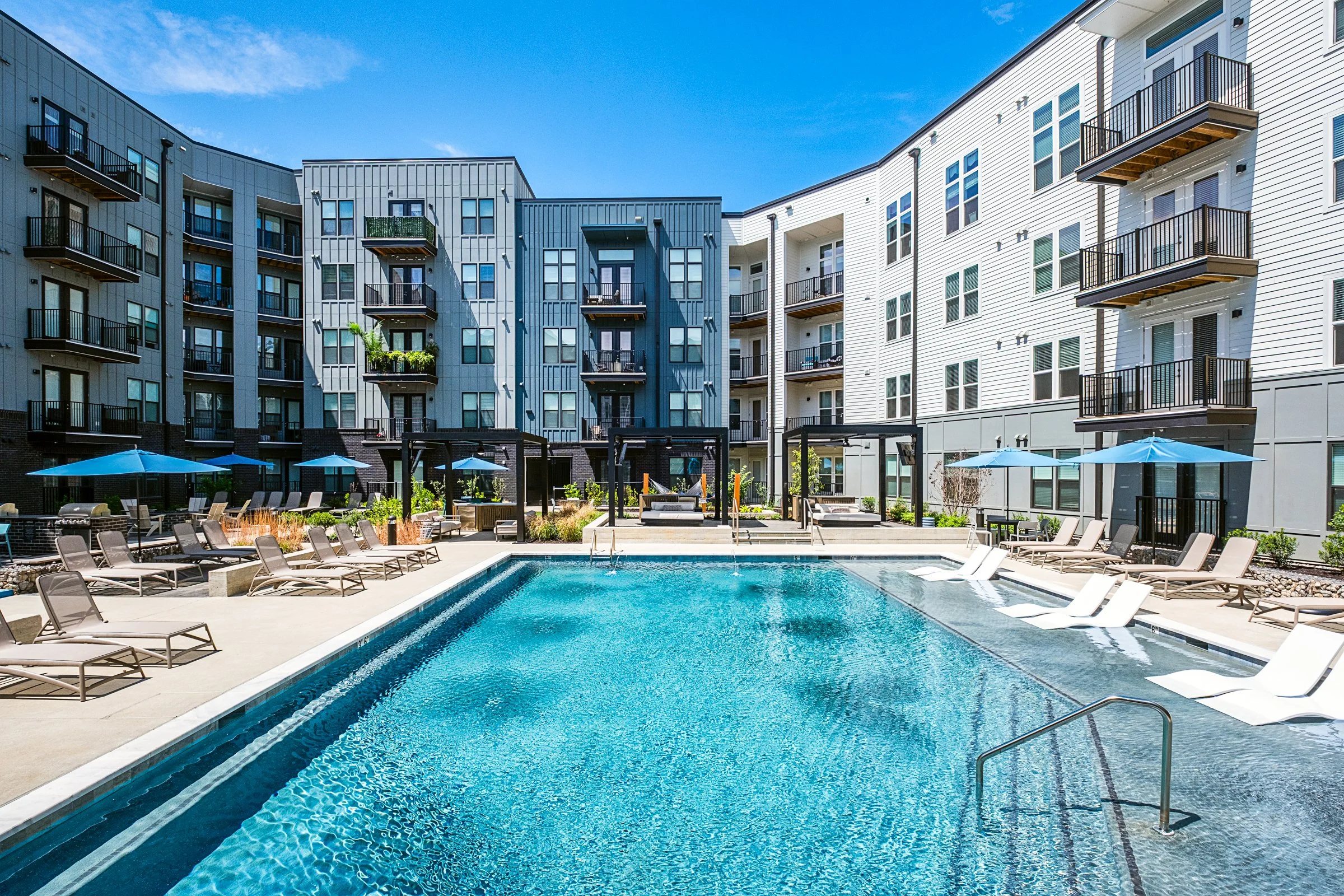 Architectural photography by Paul Lange of Lange Photo Studio, showcasing The Guild in Richmond, VA. The series captures the building's modern design, vibrant communal spaces, rooftop lounge, resort-style pool, highlighting the dynamic living experie