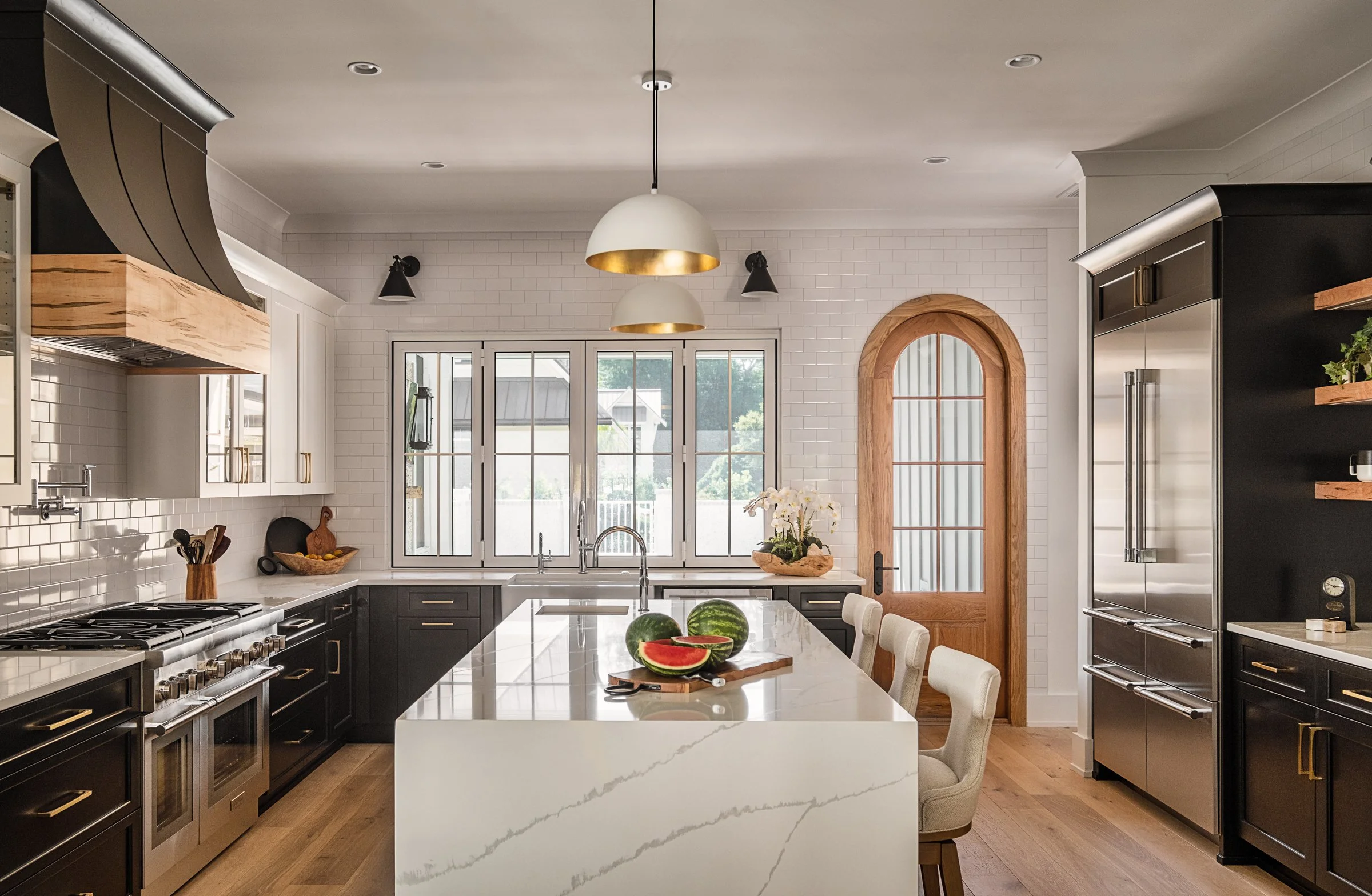 Dwelling Place Interiors luxury residential interior design project featuring a custom kitchen renovation, high-end cabinetry and millwork, detailed tilework, beautifully designed bathrooms, living spaces, bookshelves, and outdoor living areas, photo