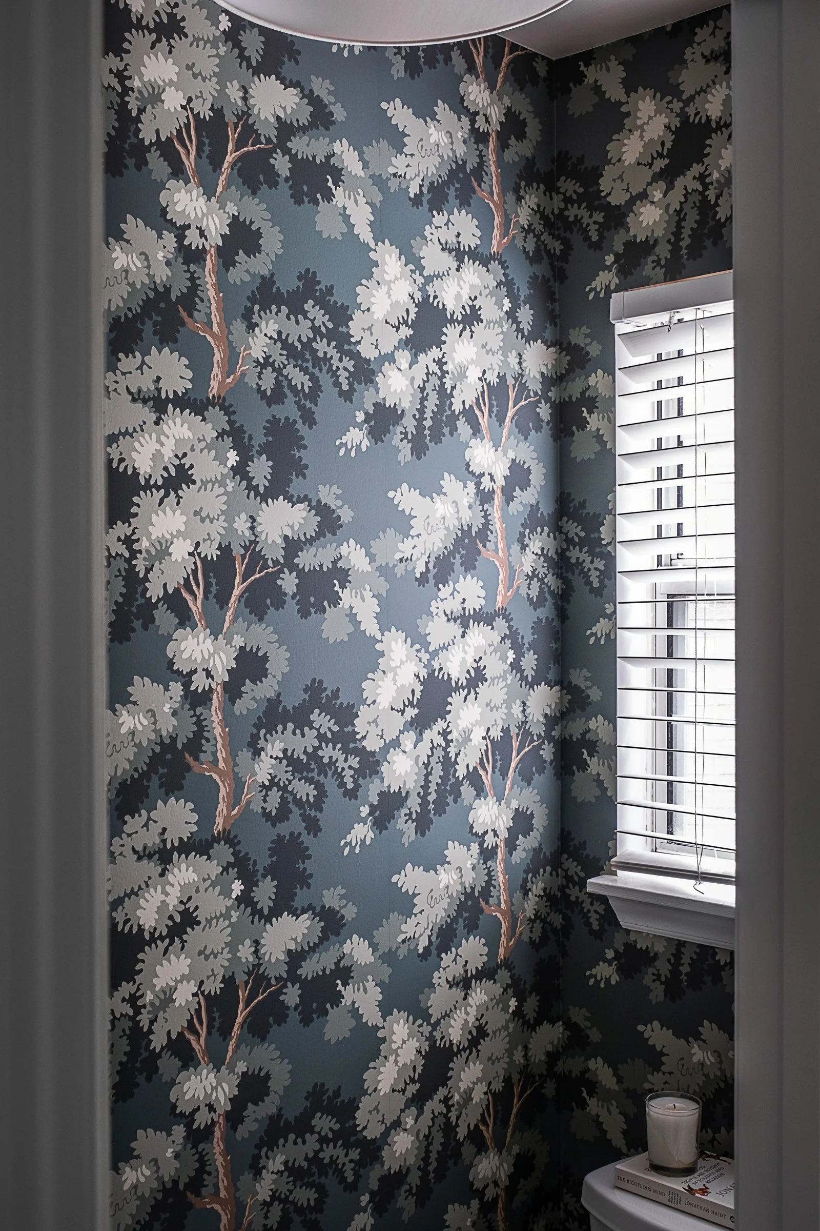 This luxury residential bathroom in North Carolina designed by Veritas Construction. Photographed by Charlotte-based architectural and interior photographer Paul Lange, this interior design photography series highlights custom wallpaper, and thoughtf