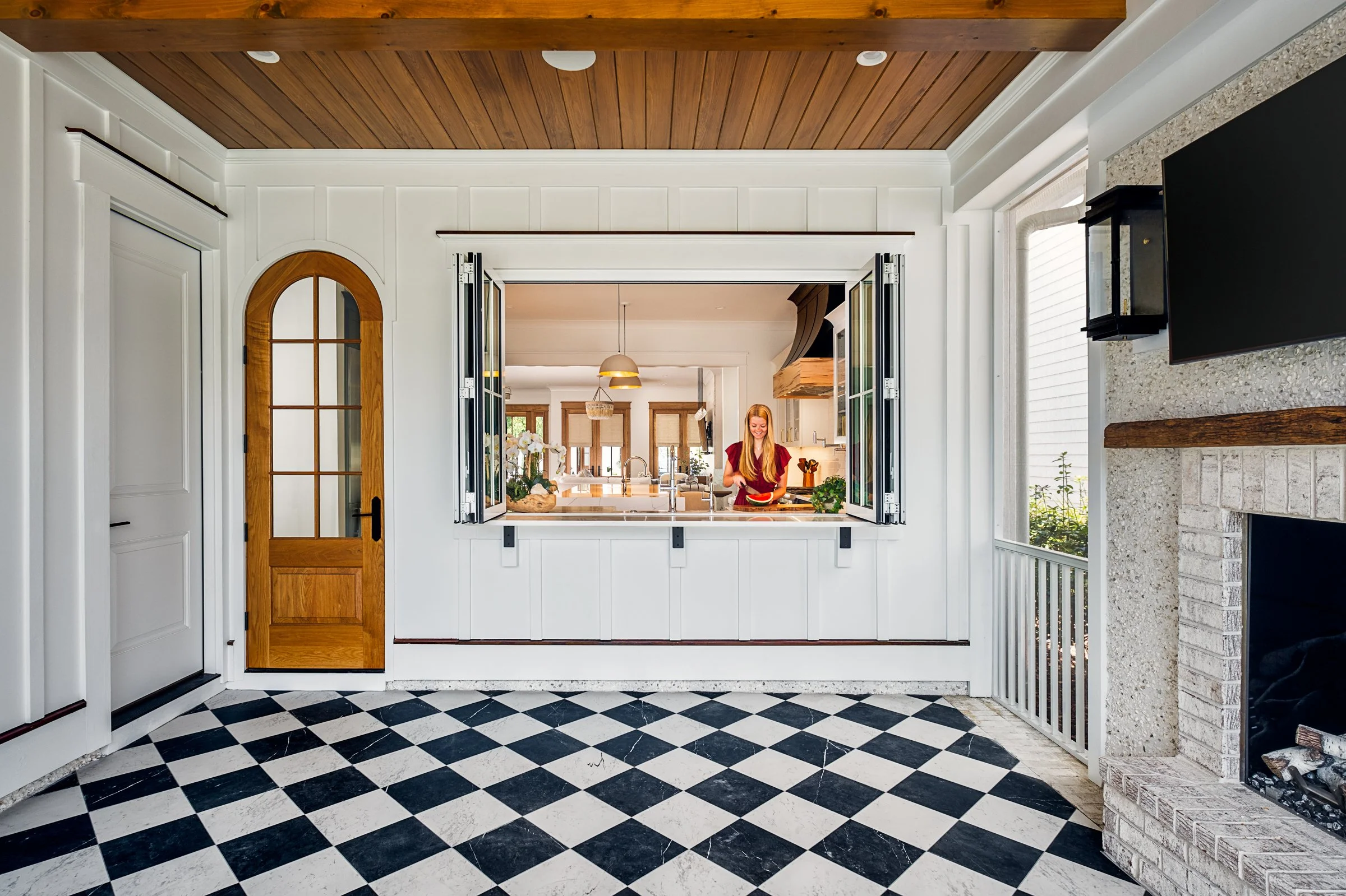 Dwelling Place Interiors luxury residential interior design project featuring a custom kitchen renovation, high-end cabinetry and millwork, detailed tilework, beautifully designed bathrooms, living spaces, bookshelves, and outdoor living areas, photo