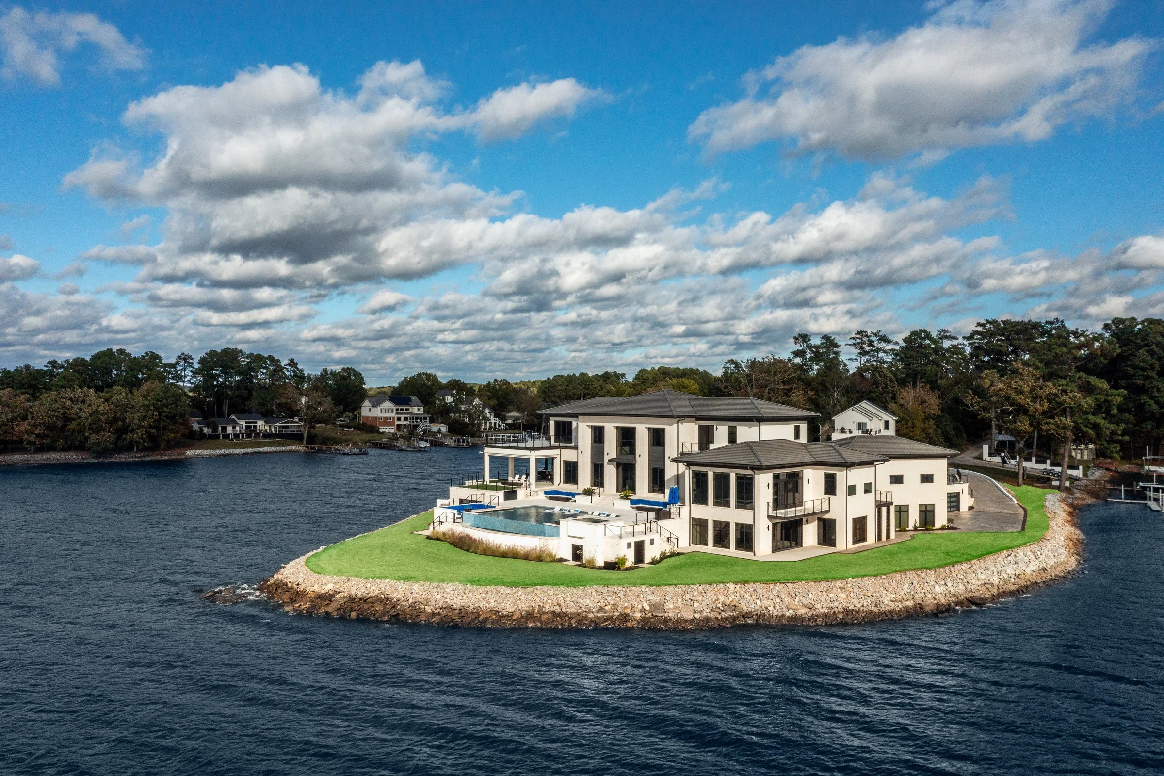 Architectural and interior photography of a customized lakefront home, highlighting design detail, atmosphere, infinity pool, and craftsmanship.