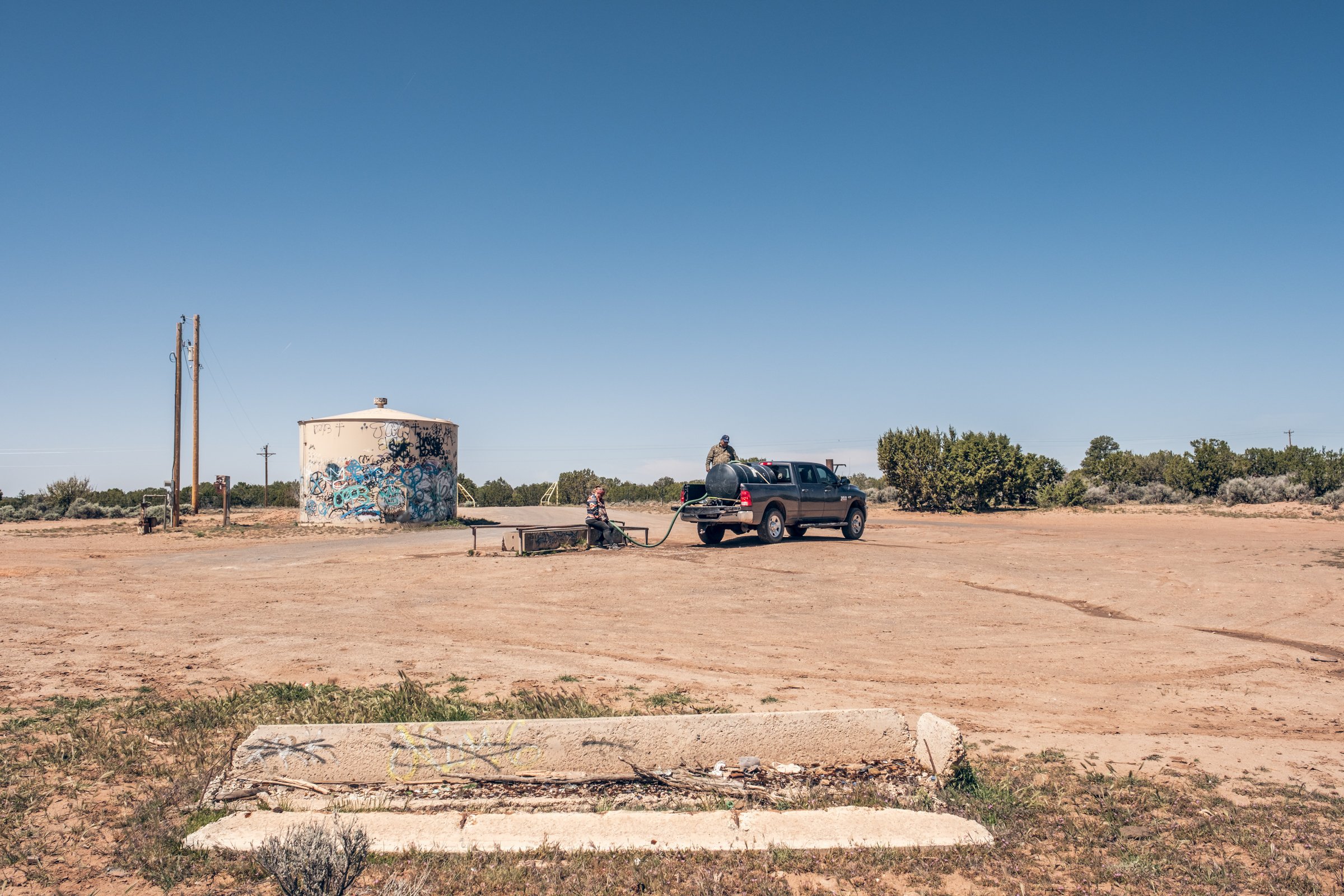 Hauling Life | Navajo Nation 

Wayne Wilson and Joann Whiting collect water in Gallup, New Mexico at a community water source. The containers are filled, prepared, and loaded into their vehicle for transport across the Navajo Nation.

They depart on 