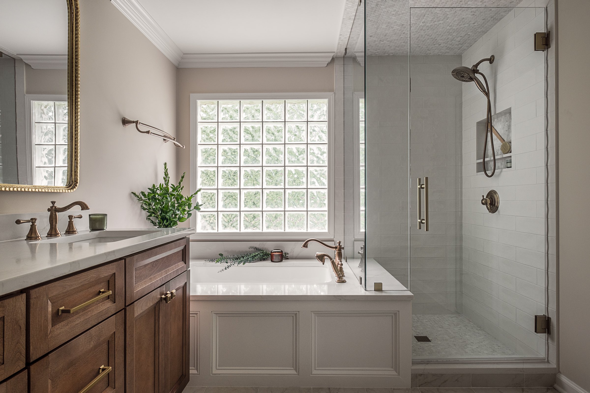 This luxury residential bathroom in North Carolina designed by Veritas Construction. Photographed by Charlotte-based architectural and interior photographer Paul Lange, this interior design photography series highlights custom wallpaper, and thoughtf