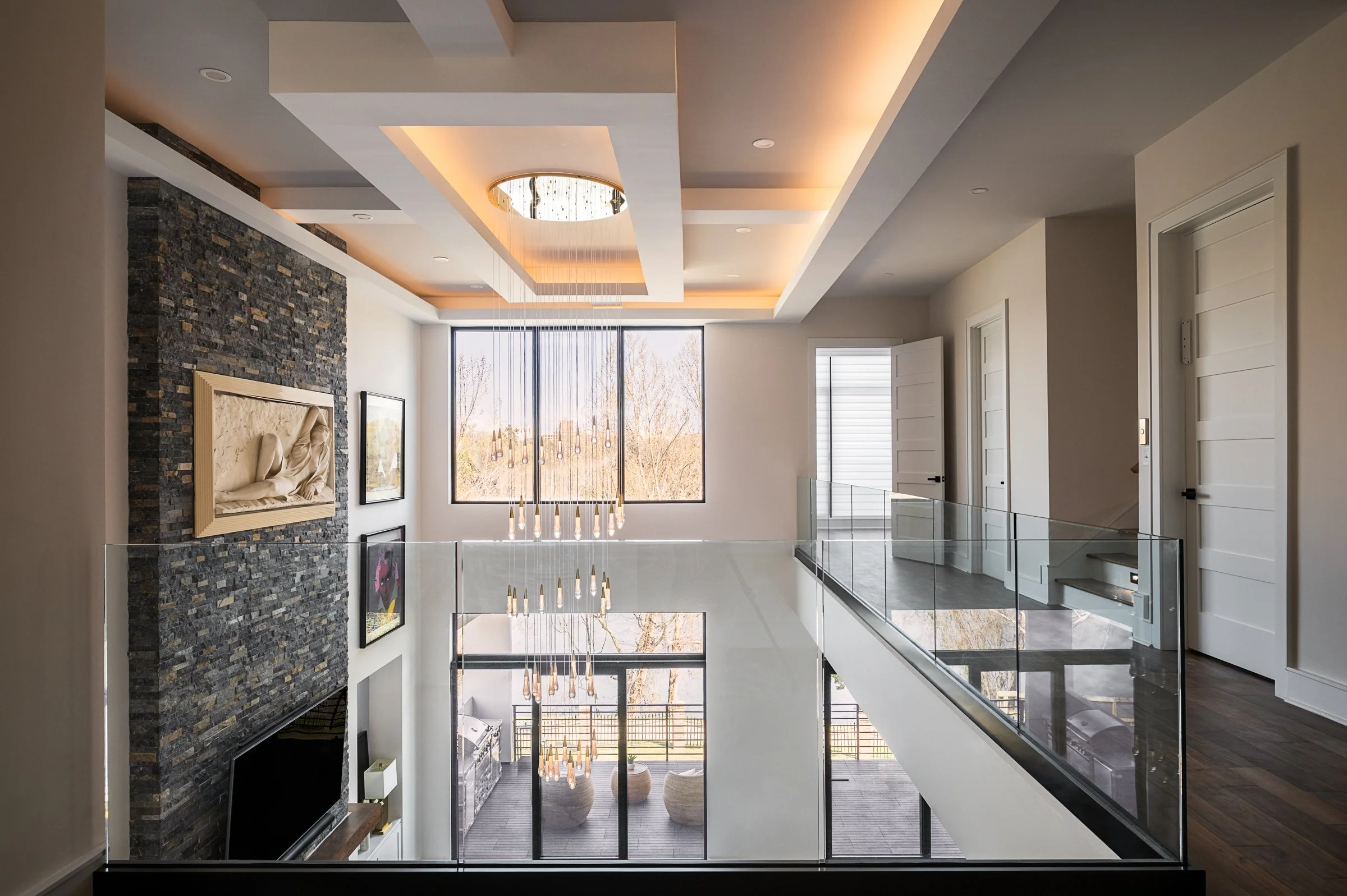 Architectural and interior photography of a customized lakefront home, highlighting design detail, atmosphere, infinity pool, and craftsmanship.