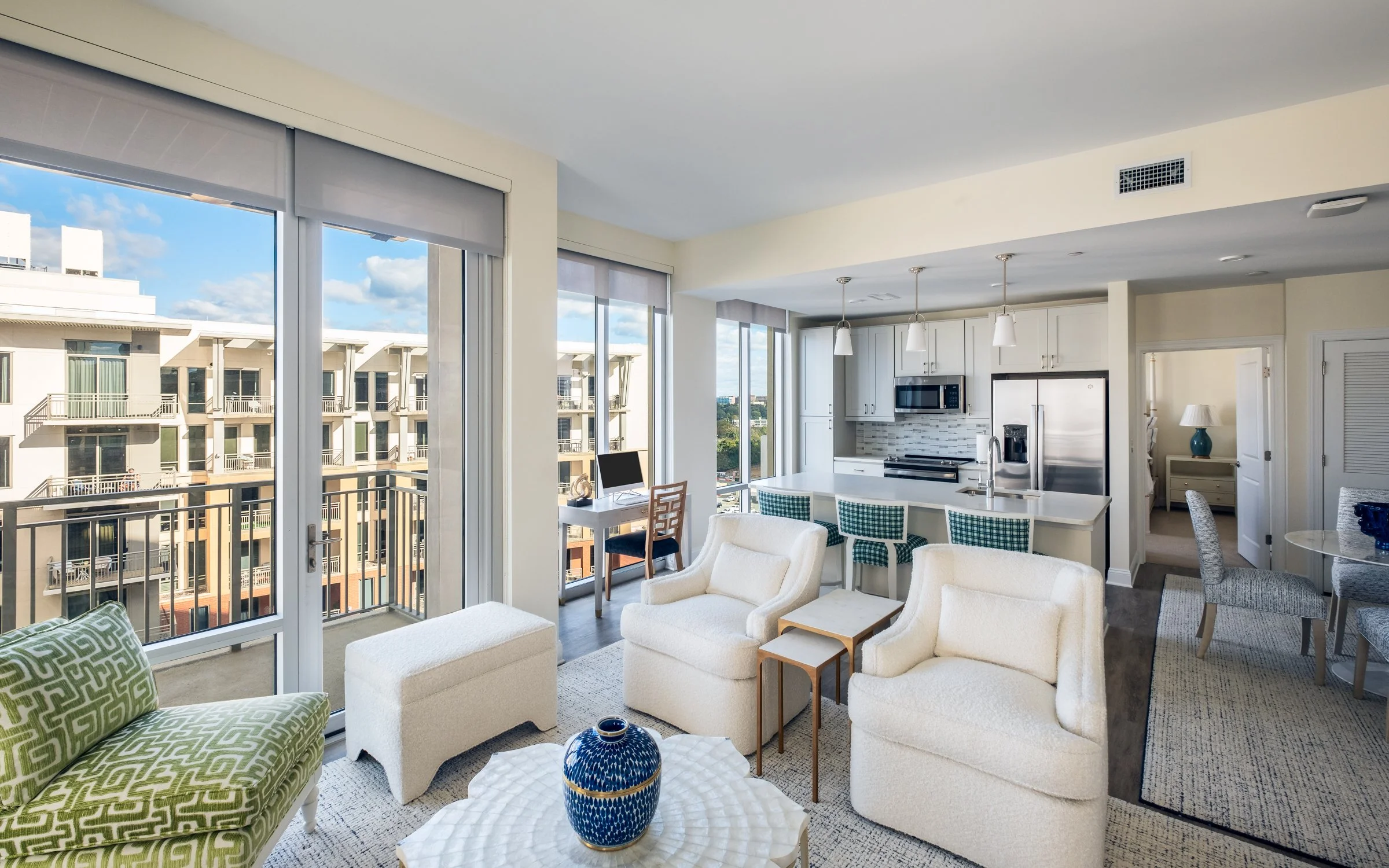 Open concept dining and entertainment space in Village on Morehead unit highlighting contemporary design elements