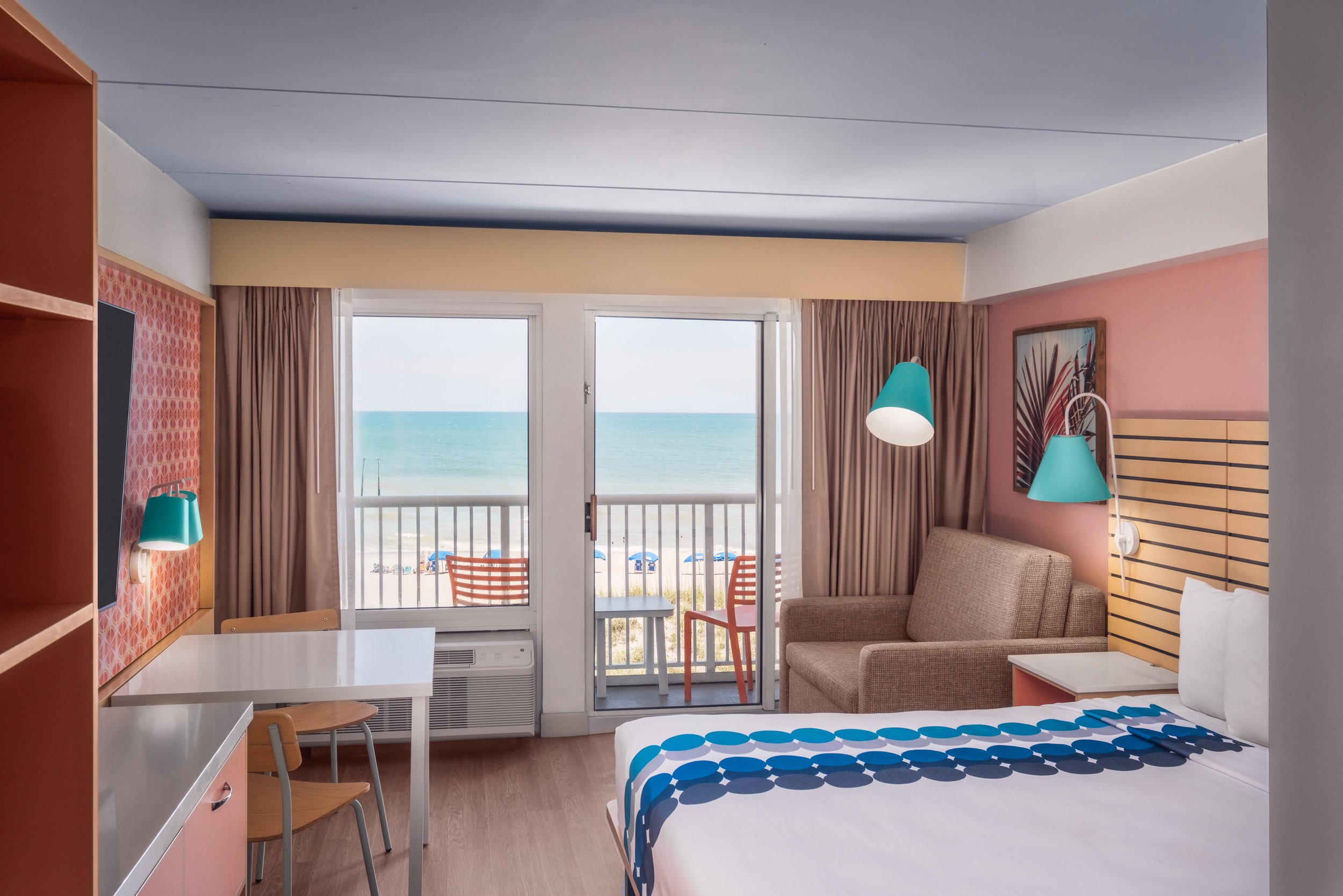 Warm hospitality photography of guest room at Golden Sands Hotel, showing thoughtful composition, branded consistency, and uncluttered guest environment.