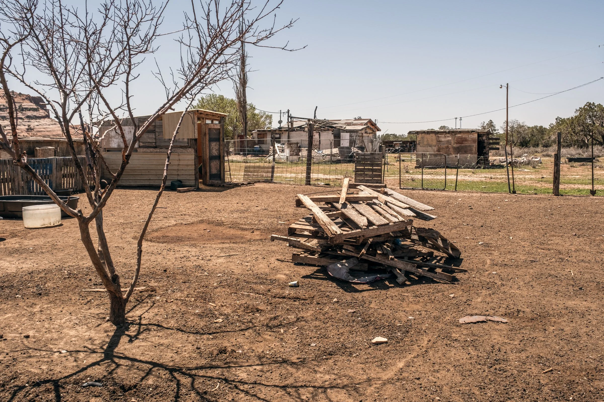 Hauling Life | Navajo Nation — Unified Metadata Paragraphs

Wayne Wilson and Joann Whiting collect water in Gallup, New Mexico at a community water source. The containers are filled, prepared, and loaded into their vehicle for transport across the Na