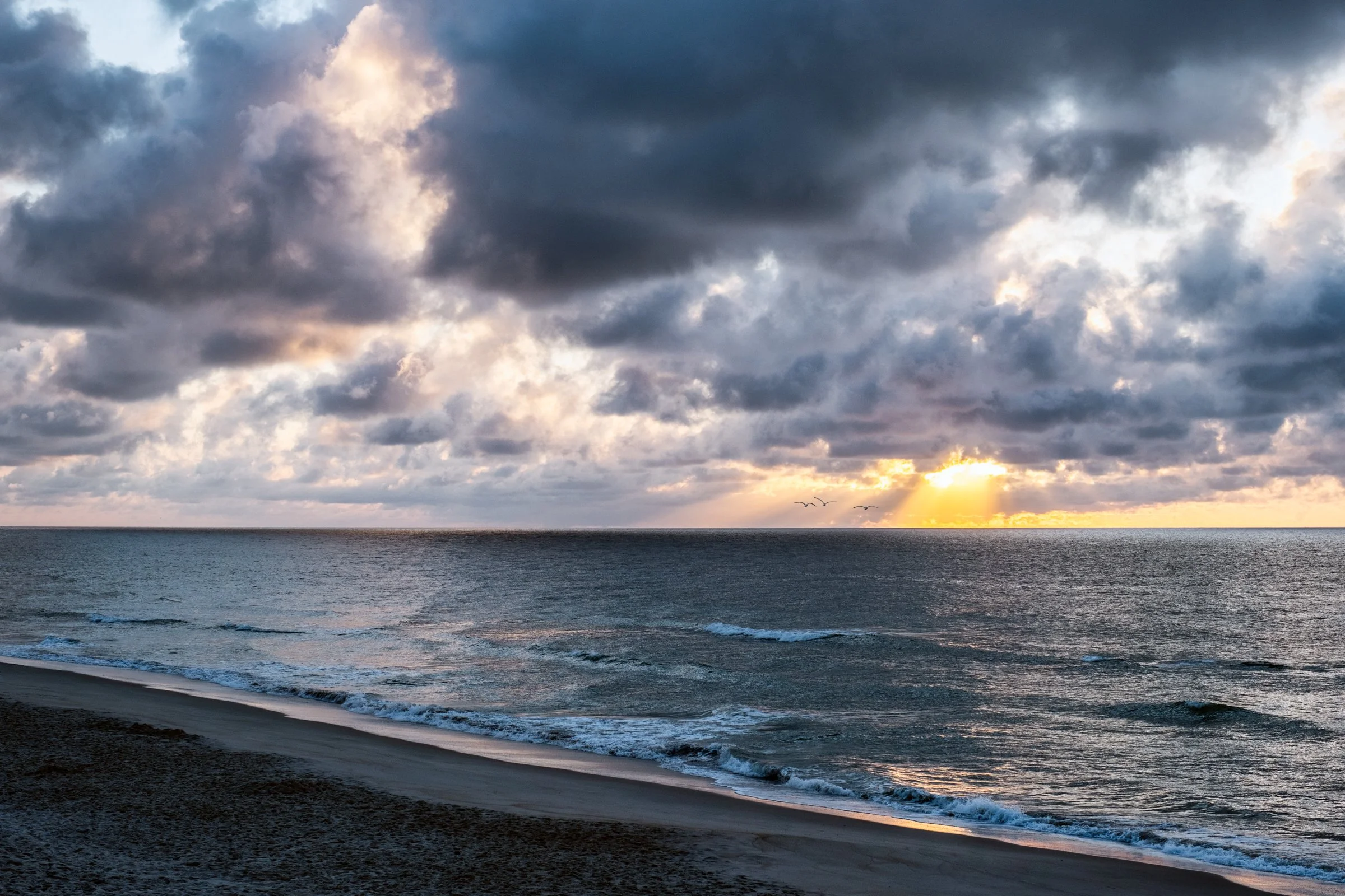 Sunrise at Golden Sands Hotel in Carolina Beach, photographed by Lange Photo Studio. 
