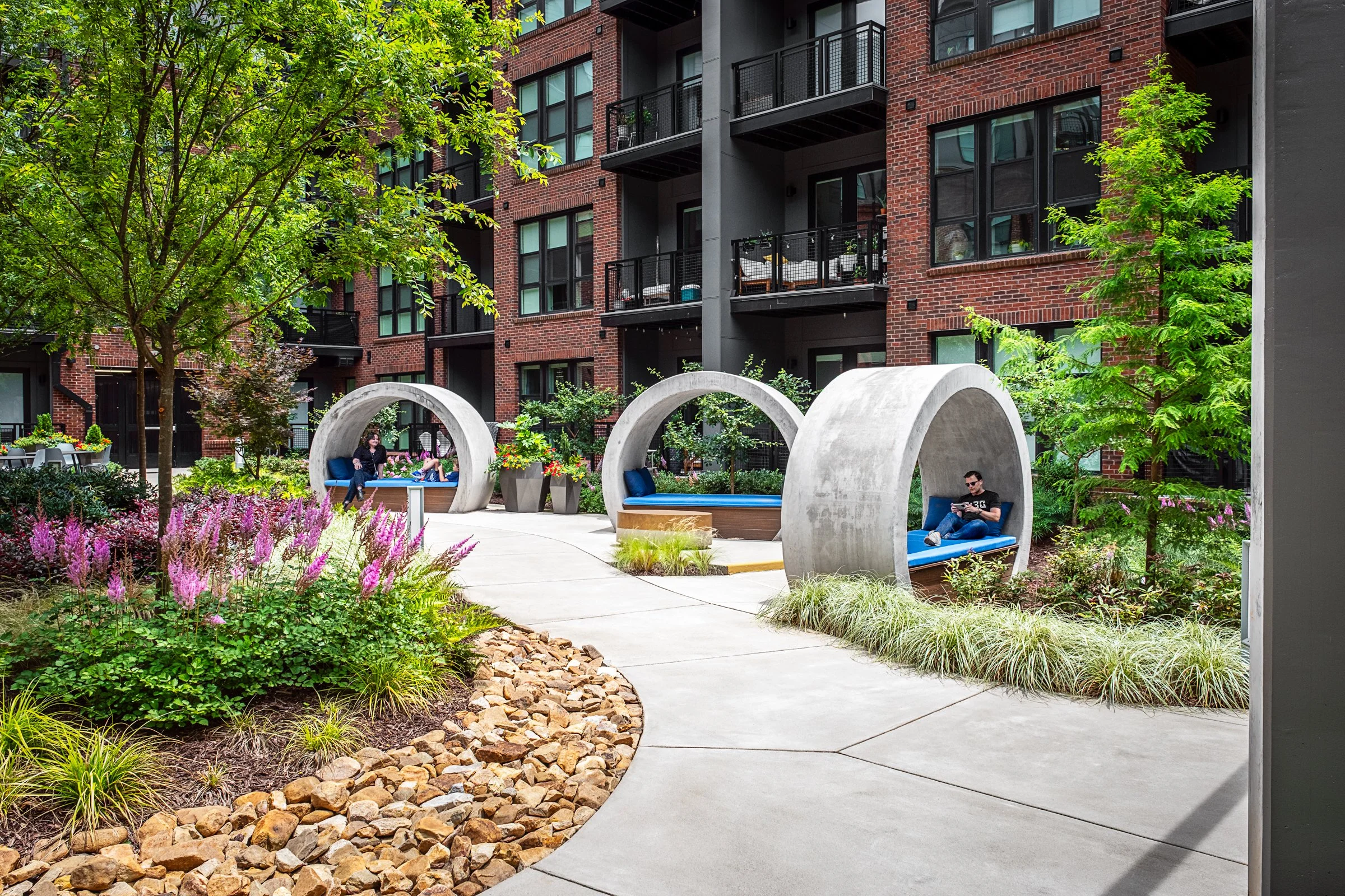 Multi family Camden NODA in Charlotte, NC, designed by LandDesign featuring a stunning amenity space. Photographed by Lange Photo Studio.