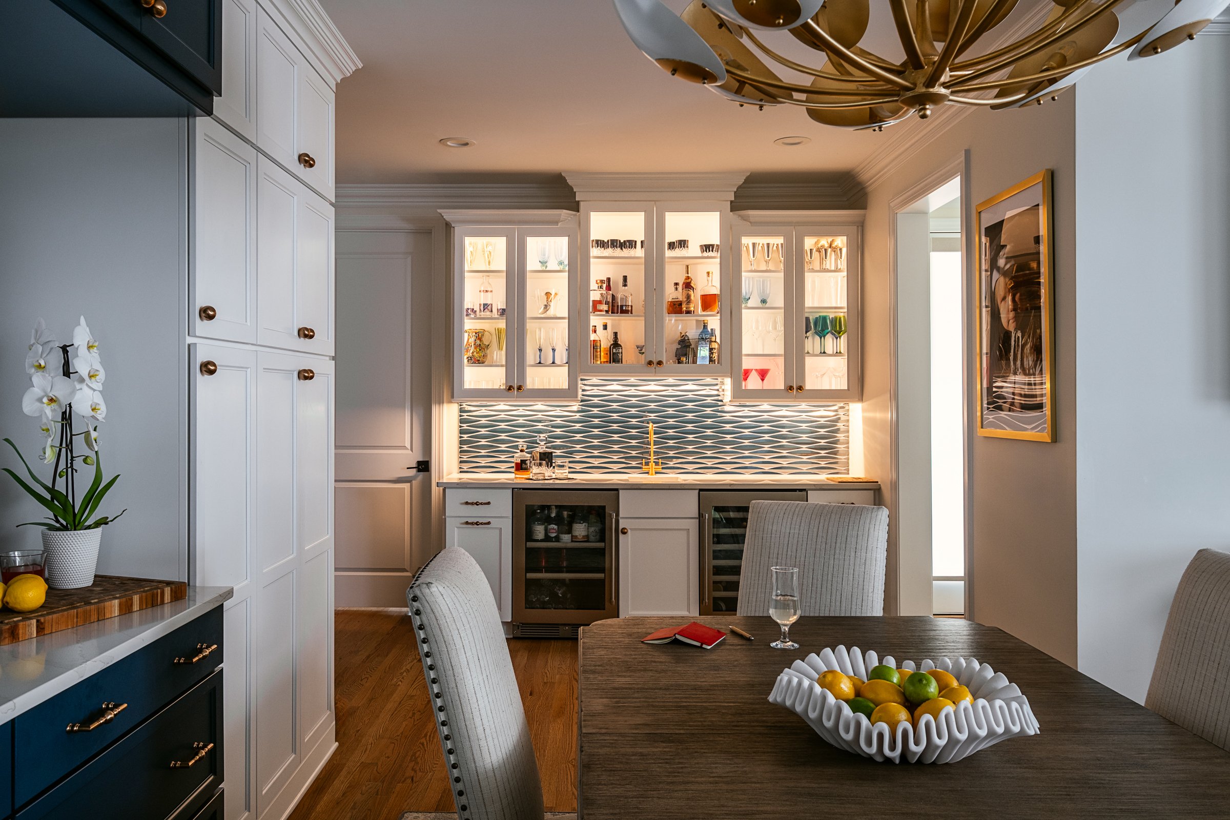 Bardi Designs stunning bar with elevated lighting in Cary, NC, photographed by Lange Photo Studio. 