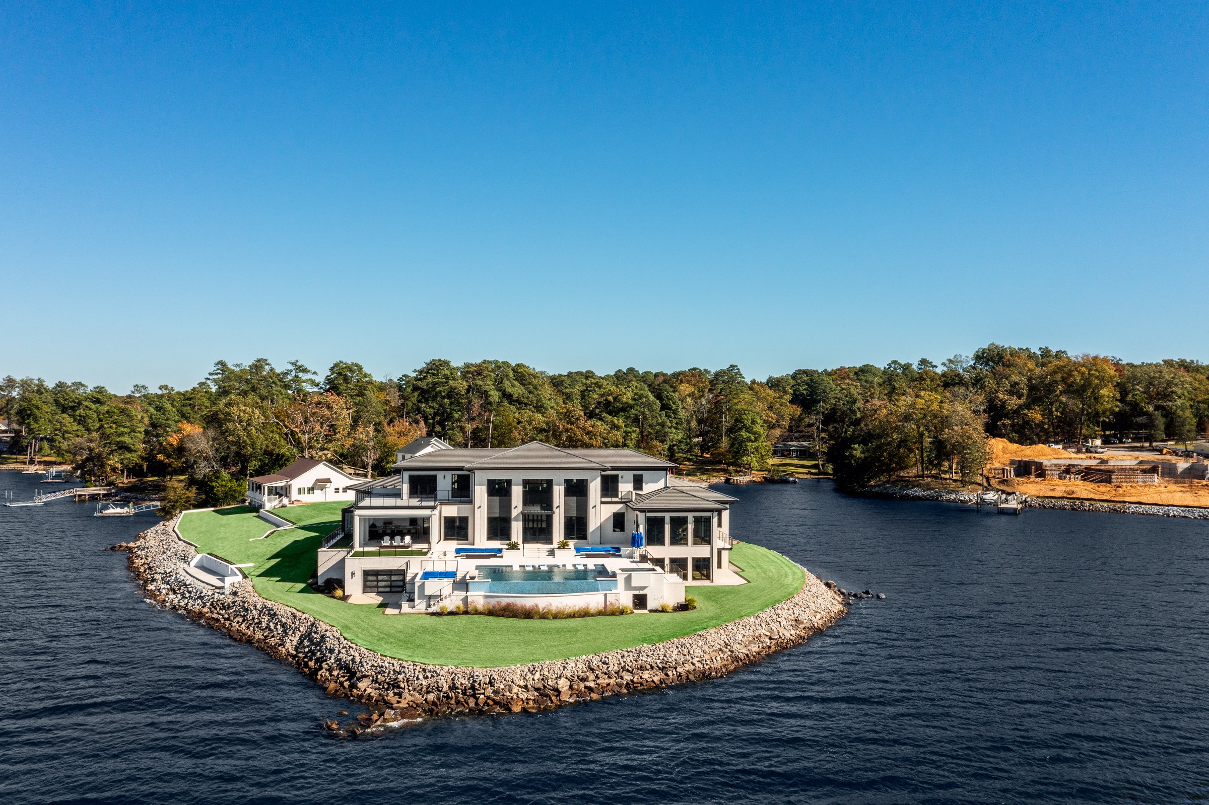 Architectural and interior photography of a customized lakefront home, highlighting design detail, atmosphere, infinity pool, and craftsmanship.