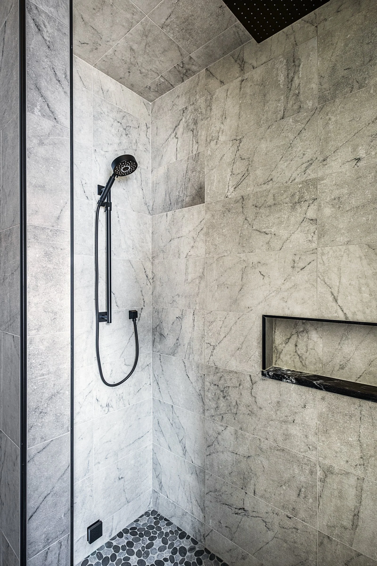 Dwelling Place Interiors luxury residential interior design project featuring a custom kitchen renovation, high-end cabinetry and millwork, detailed tilework, beautifully designed bathrooms, living spaces, bookshelves, and outdoor living areas, photo