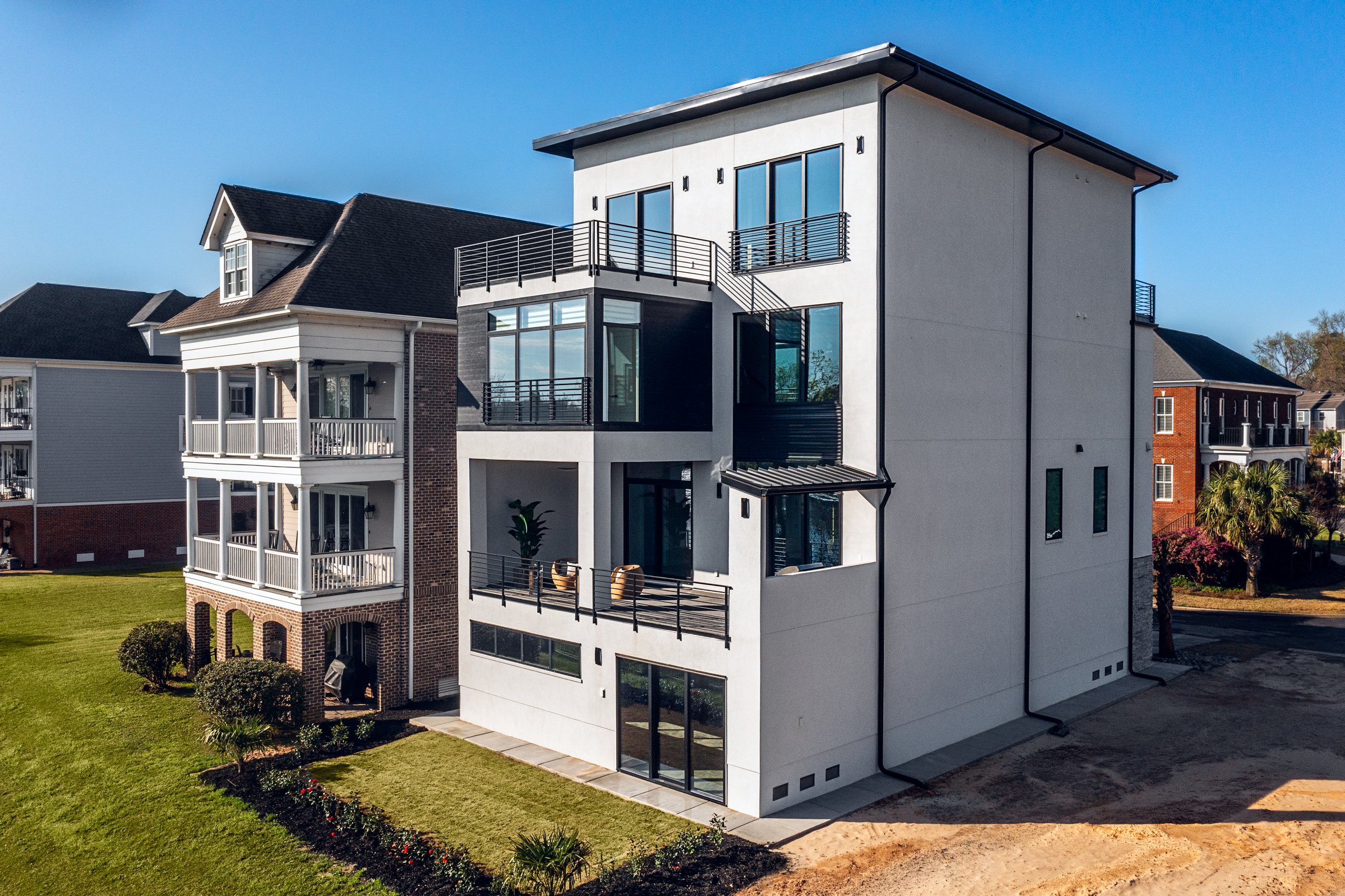 Architectural and interior photography of a customized lakefront home, highlighting design detail, atmosphere, infinity pool, and craftsmanship.