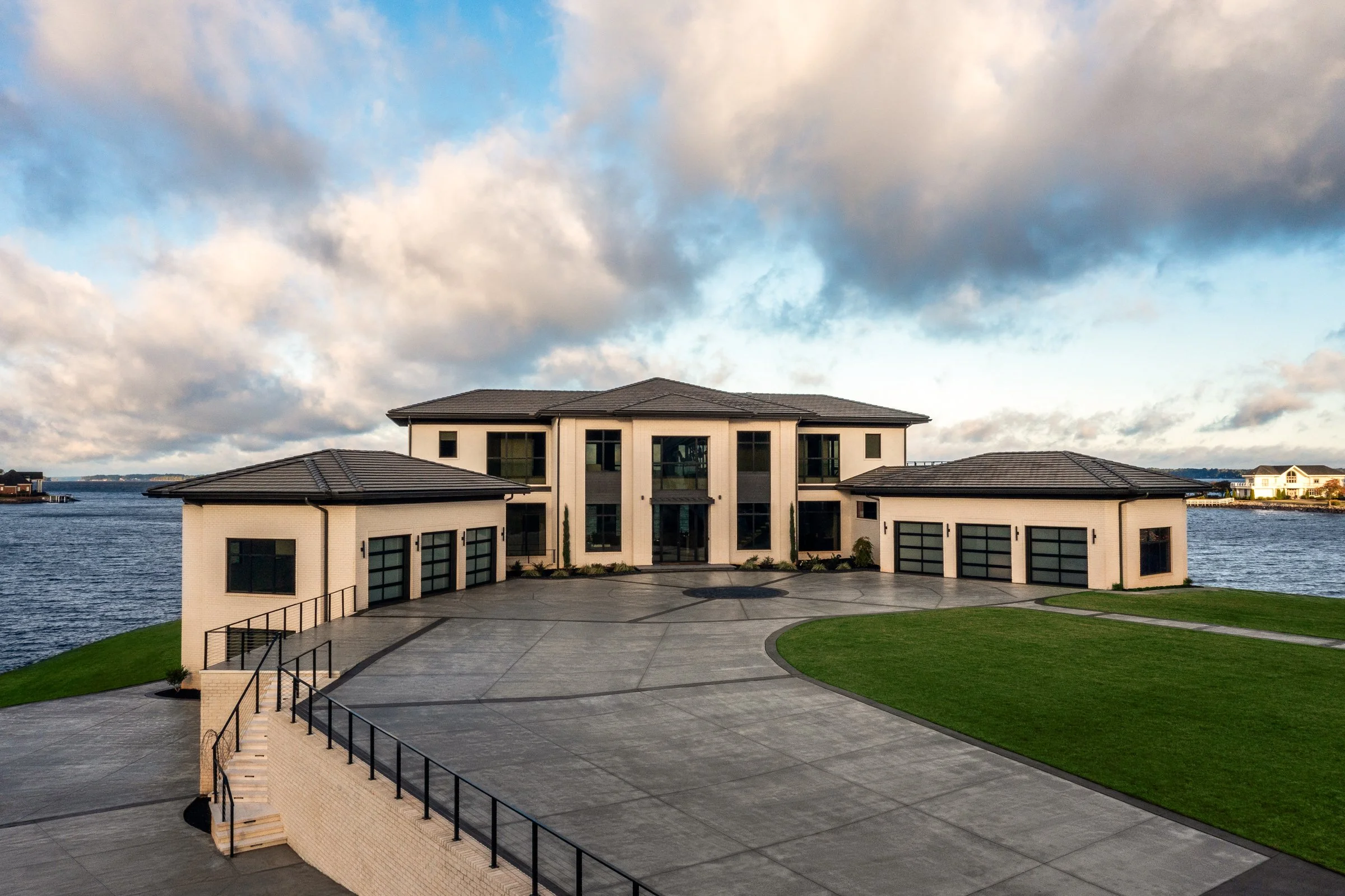 Architectural and interior photography of a customized lakefront home, highlighting design detail, atmosphere, infinity pool, and craftsmanship.