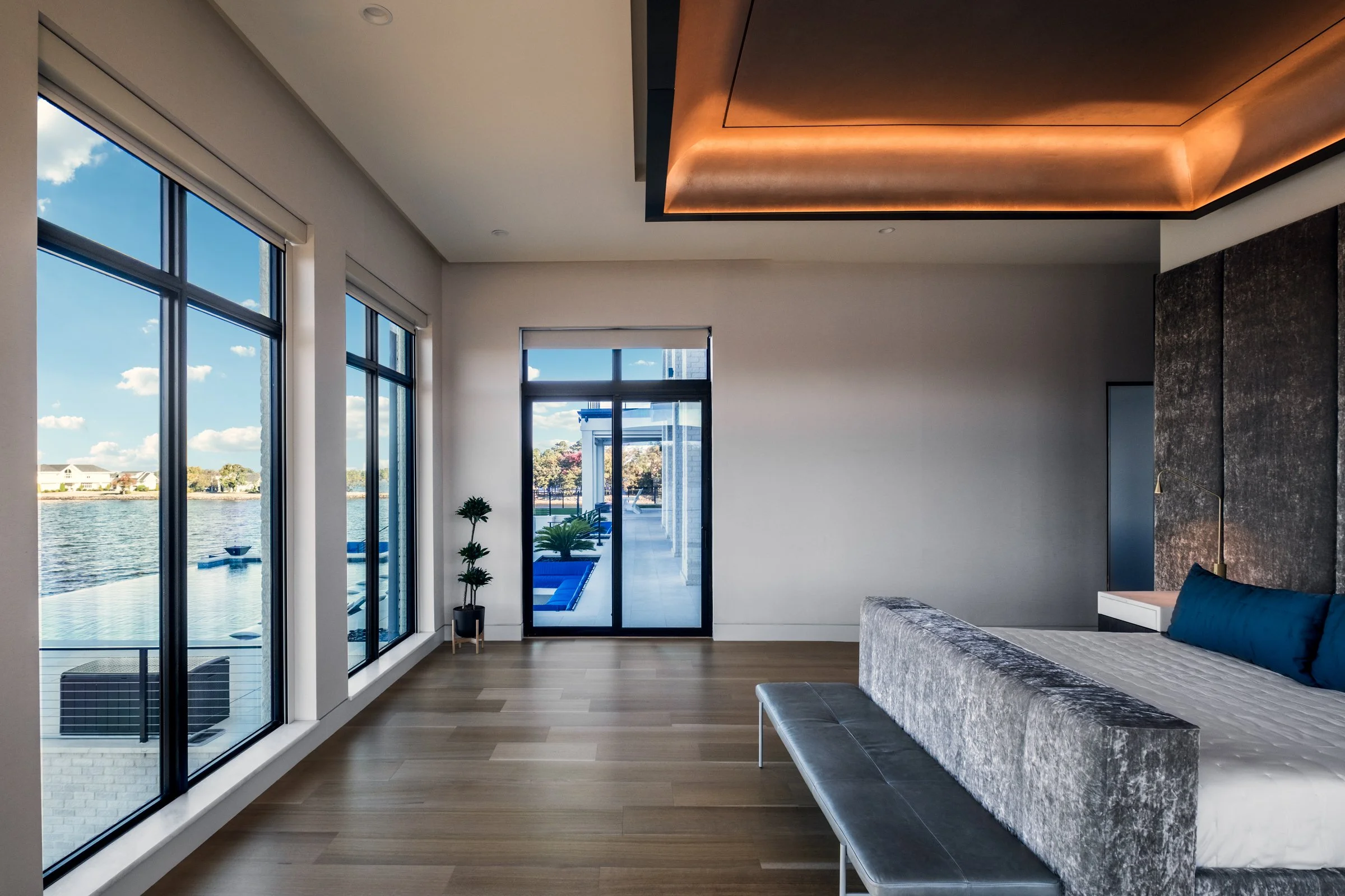 Architectural and interior photography of a customized lakefront home, highlighting design detail, atmosphere, infinity pool, and craftsmanship.