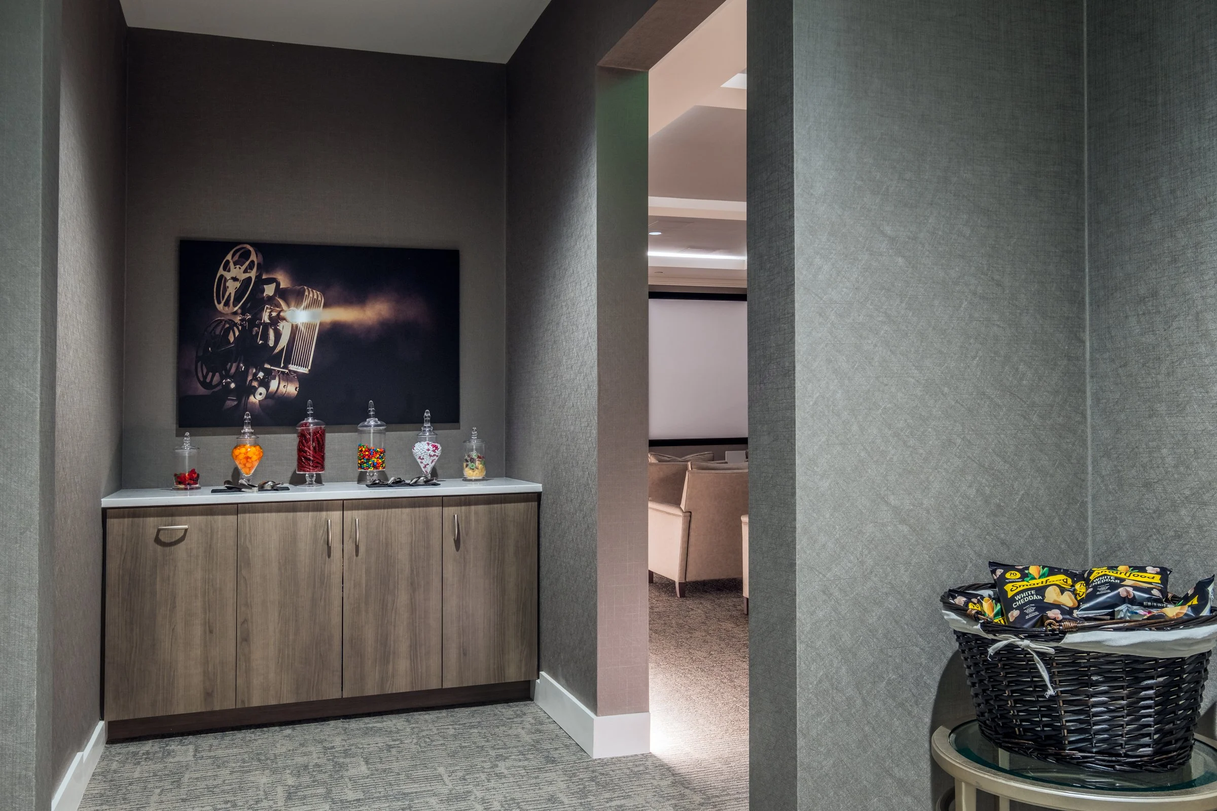 Spacious modern movie theatre of Village on Morehead featuring natural light, contemporary furniture, and architectural details