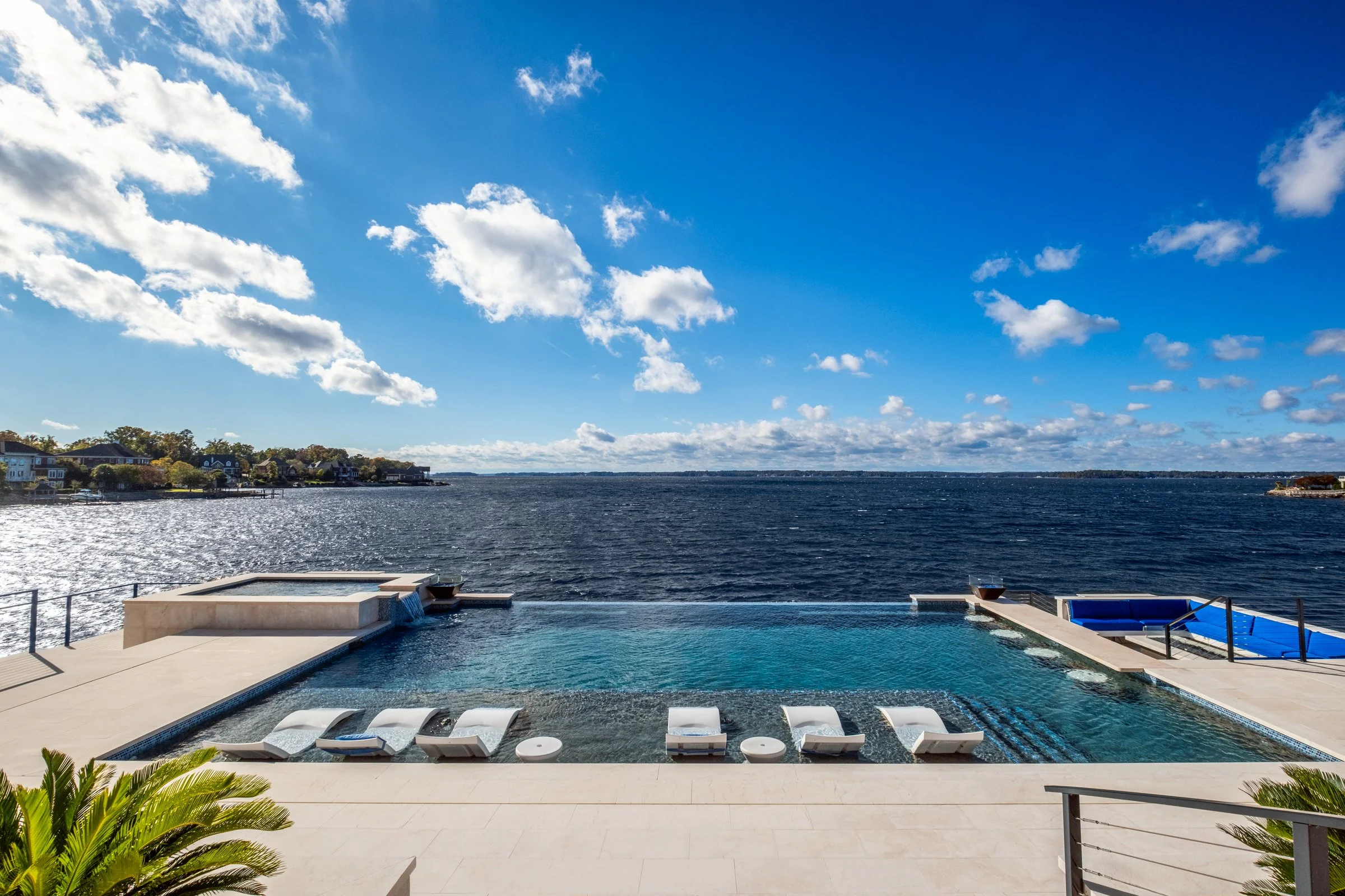 Architectural and interior photography of a customized lakefront home, highlighting design detail, atmosphere, infinity pool, and craftsmanship.
