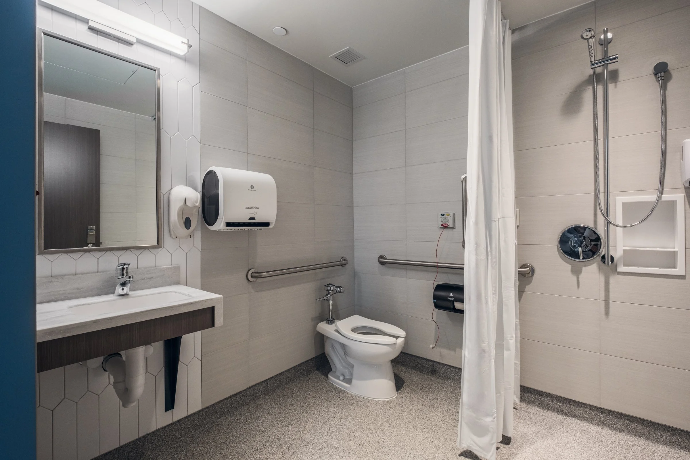 Interior view of an ADA bathroom at Atrium Health, highlighting modern design and patient comfort.