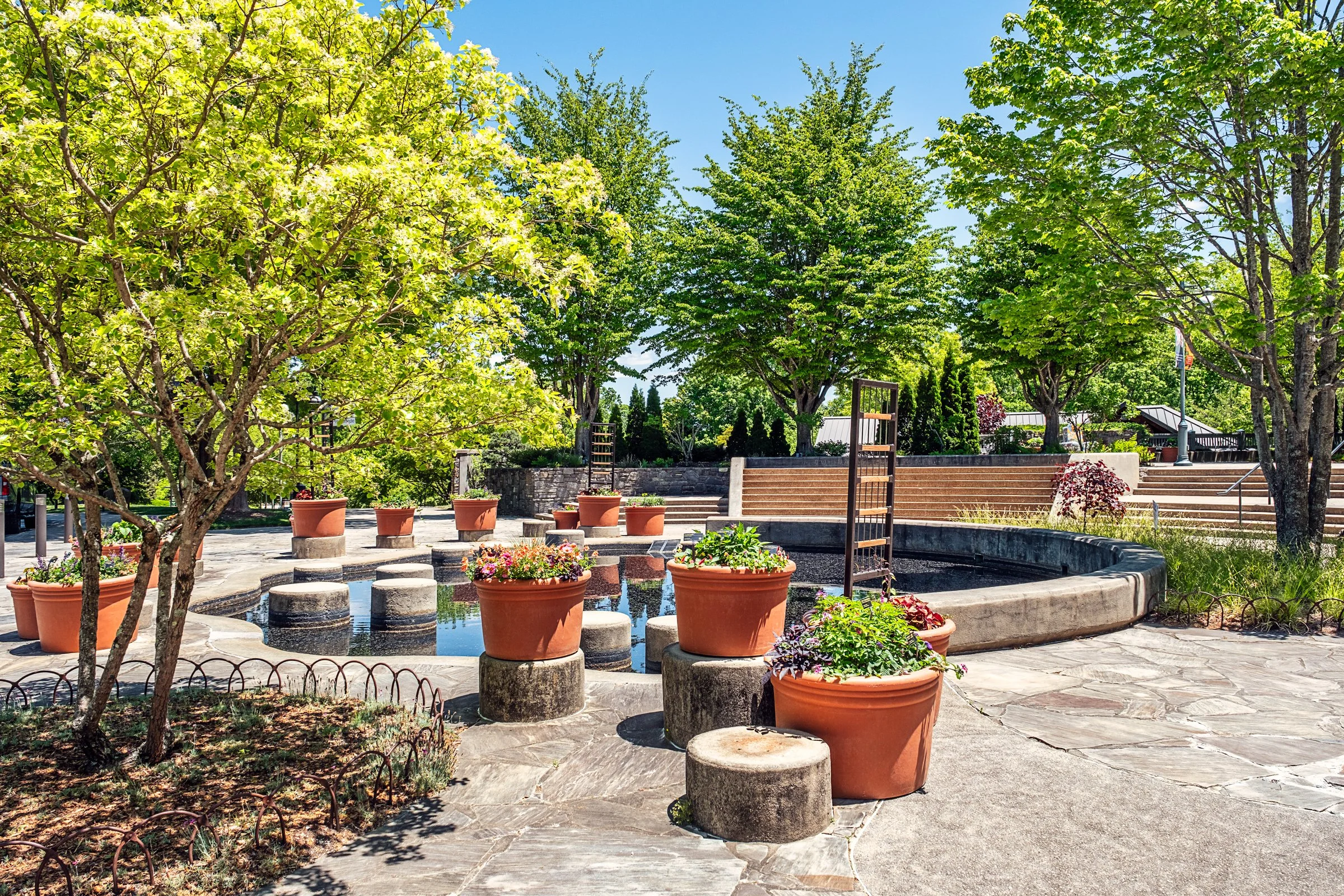 A quiet garden path and bonsai display at the North Carolina Arboretum near Asheville, North Carolina. Photographed by Lange Photo Studio. 