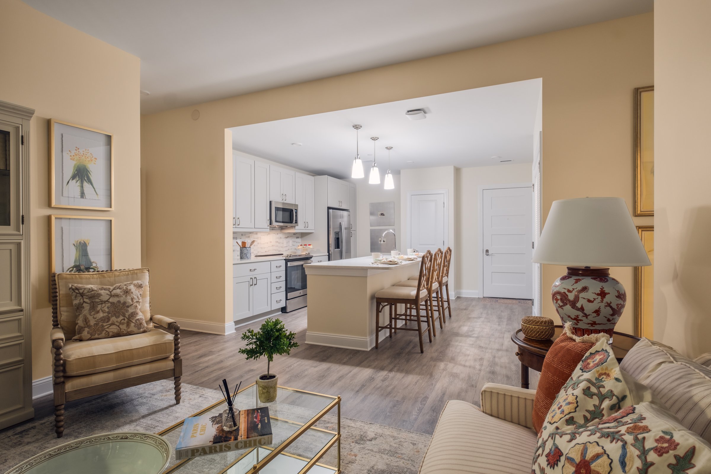 Open concept dining and entertainment space in Village on Morehead unit highlighting contemporary design elements