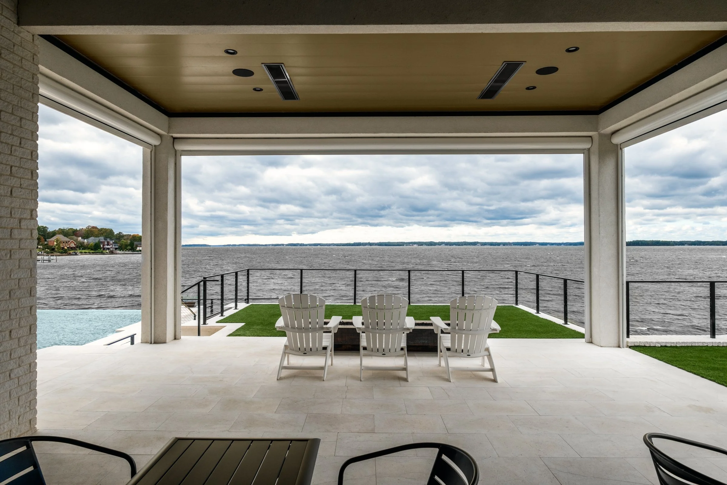 Architectural and interior photography of a customized lakefront home, highlighting design detail, atmosphere, infinity pool, and craftsmanship.