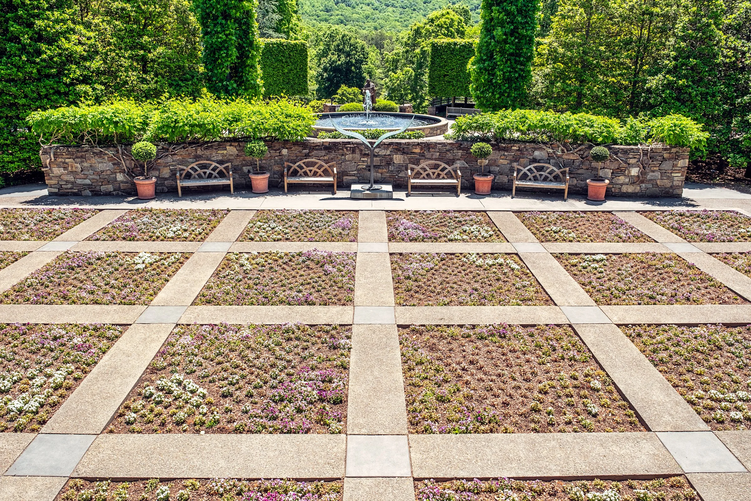 A quiet garden path and bonsai display at the North Carolina Arboretum near Asheville, North Carolina. Photographed by Lange Photo Studio. 