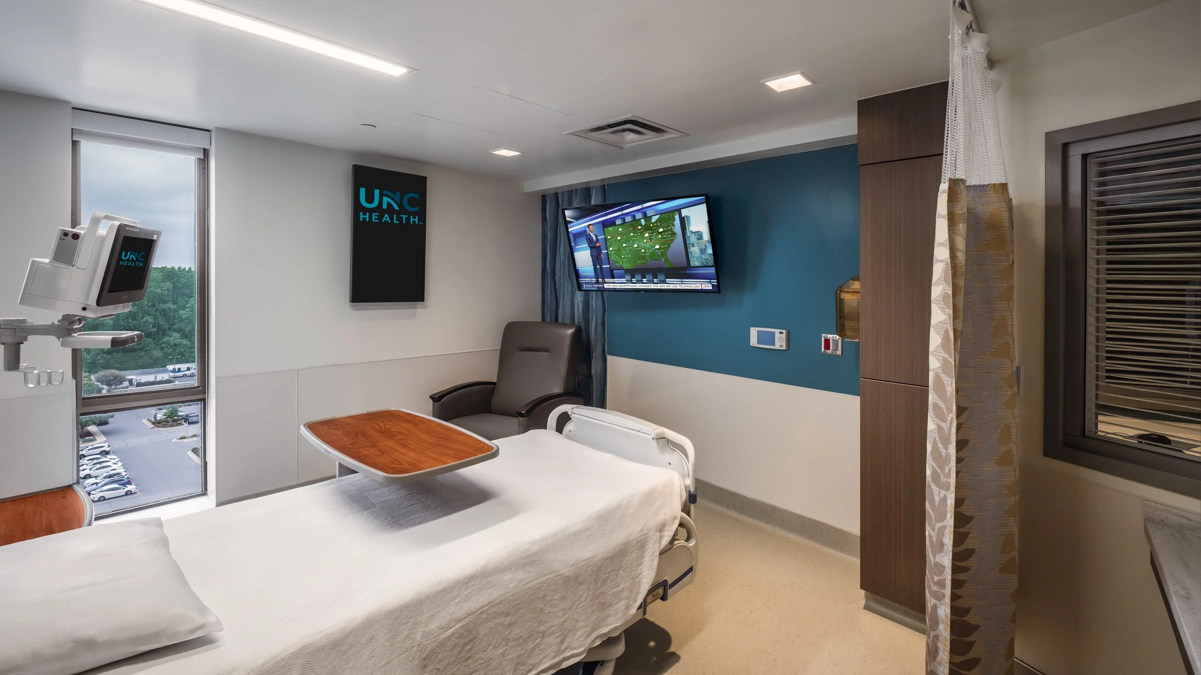 Interior view of a patient room at Wayne healthcare UNC, highlighting modern design and patient comfort.