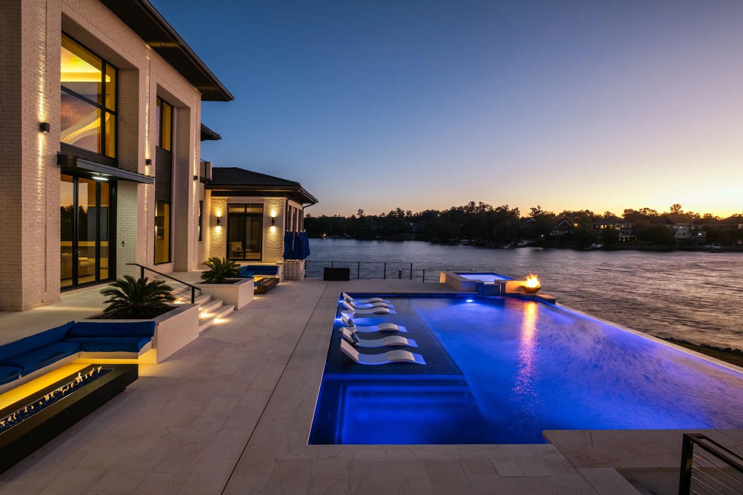 Architectural and interior photography of a customized lakefront home, highlighting design detail, atmosphere, infinity pool, and craftsmanship.