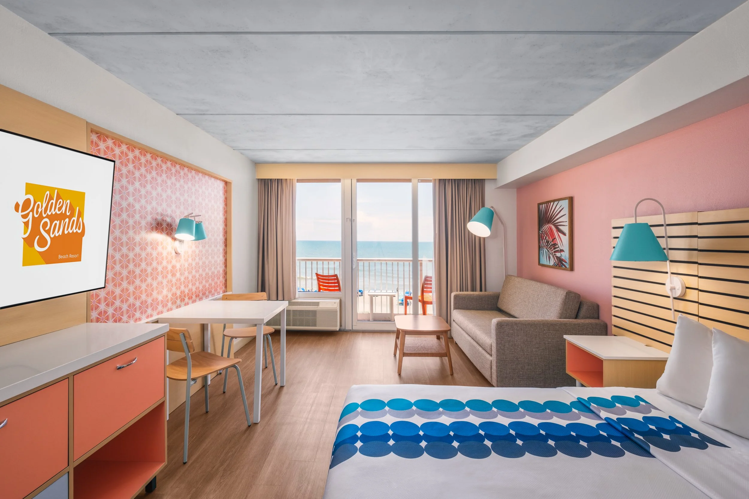 Warm hospitality photography of guest room at Golden Sands Hotel, showing thoughtful composition, branded consistency, and uncluttered guest environment.