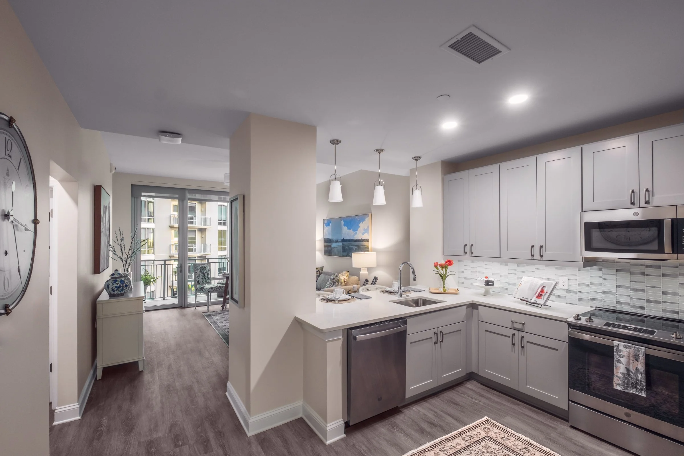 Open concept dining and entertainment space in Village on Morehead unit highlighting contemporary design elements