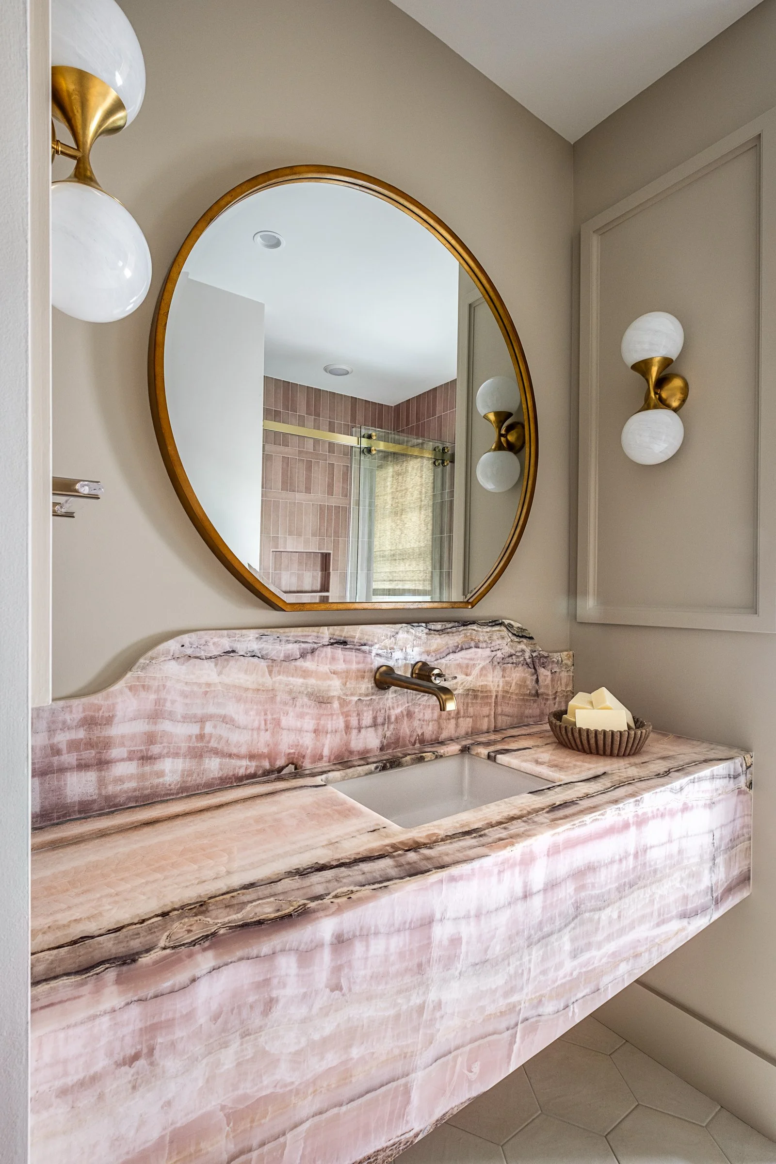 Dwelling Place Interiors luxury residential interior design project featuring a custom kitchen renovation, high-end cabinetry and millwork, detailed tilework, beautifully designed bathrooms, living spaces, bookshelves, and outdoor living areas, photo