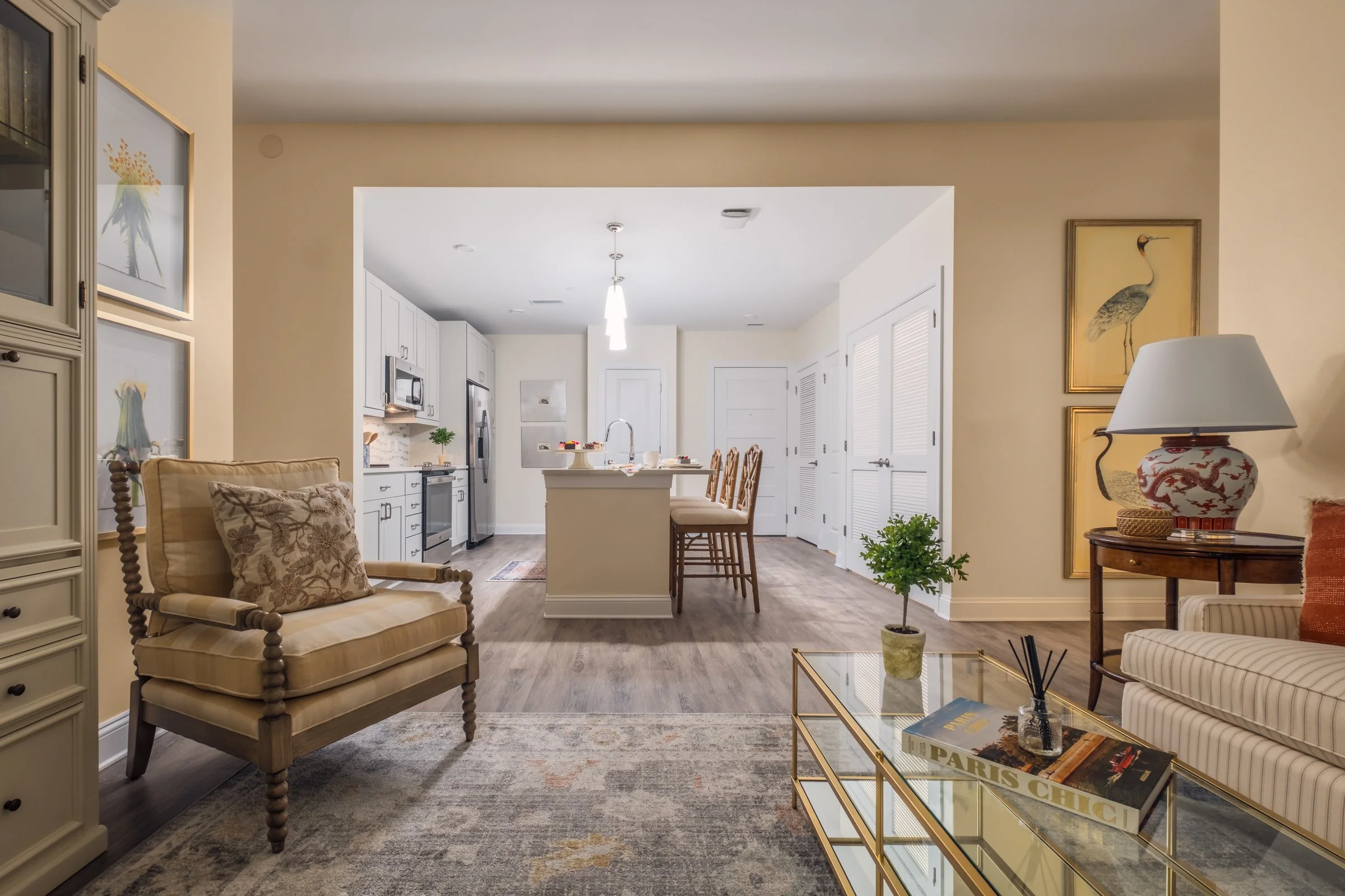 Open concept dining and entertainment space in Village on Morehead unit highlighting contemporary design elements