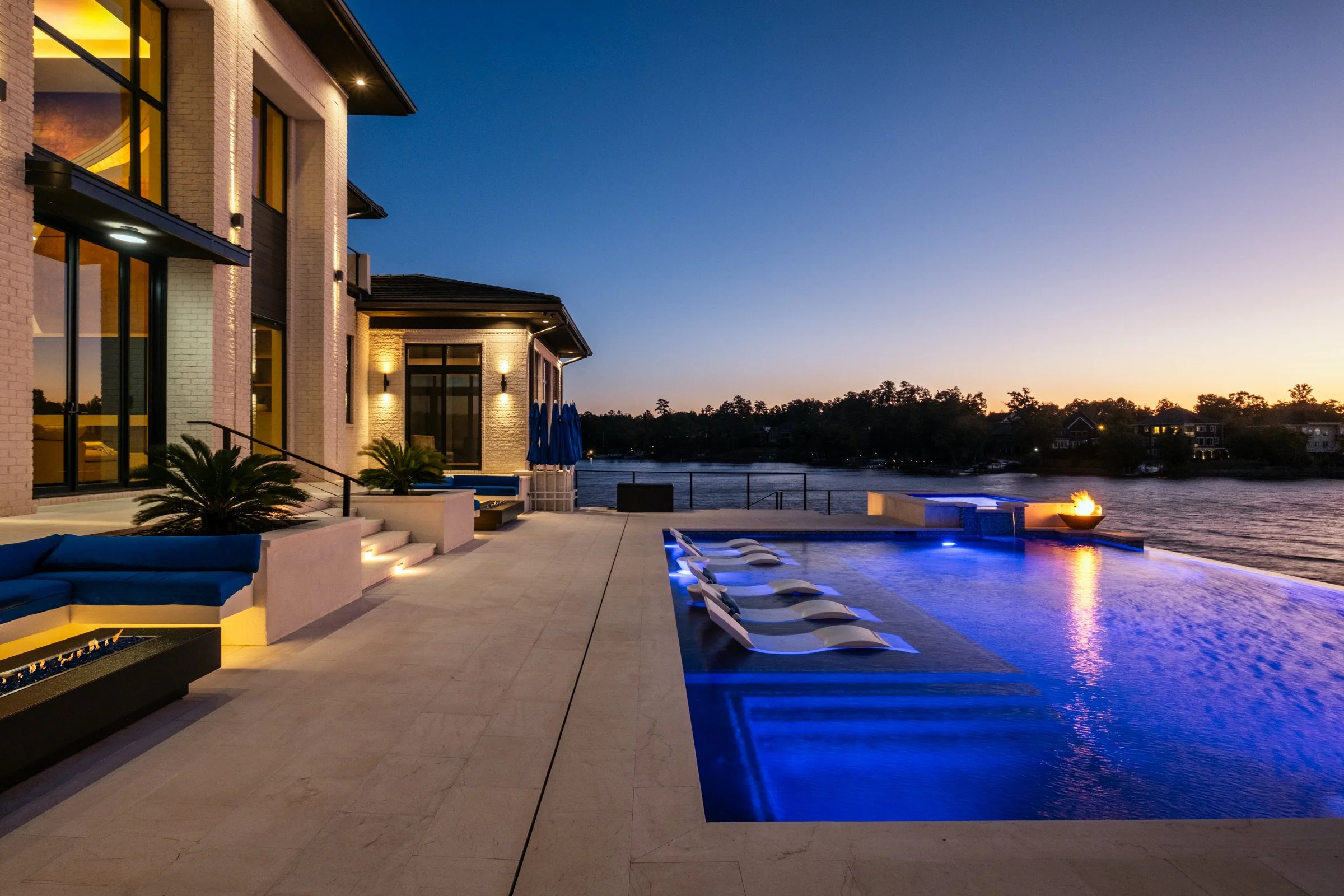 Architectural and interior photography of a customized lakefront home, highlighting design detail, atmosphere, infinity pool, and craftsmanship.